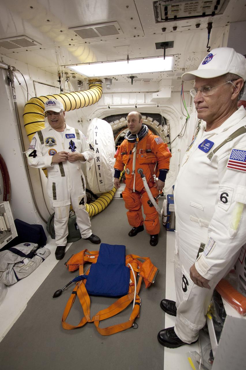 CAPE CANAVERAL, Fla. - At Launch Pad 39A at NASA's Kennedy Space Center in Florida, STS-132 Mission Specialist Garrett Reisman prepares to enter space shuttle Atlantis from the pad's White Room.  Reisman was a flight engineer on the International Space Station's Expedition 16 and 17.  The six-member STS-132 crew is participating in a dress rehearsal for launch, known as the Terminal Countdown Demonstration Test, from their seats in the crew compartment of space shuttle Atlantis.  Launch is targeted for 2:19 p.m. EDT on May 14.  On the STS-132 mission, the crew will deliver an Integrated Cargo Carrier, or ICC, and the Russian-built Mini-Research Module-1, or MRM-1, to the International Space Station.  The ICC is an unpressurized flat bed pallet and keel yoke assembly used to support the transfer of exterior cargo from the shuttle to the space station.  The MRM-1, known as Rassvet, is the second in a series of new pressurized components for Russia and will be permanently attached to the Earth-facing port of the Zarya control module. Rassvet, which translates to 'dawn,' will be used for cargo storage and provide an additional docking port to the station.  STS-132 is the 34th mission to the station and the 132nd shuttle mission overall.  For information on the STS-132 mission, visit http:__www.nasa.gov_mission_pages_shuttle_shuttlemissions_sts132_index.html. Photo credit: NASA_Jack Pfaller