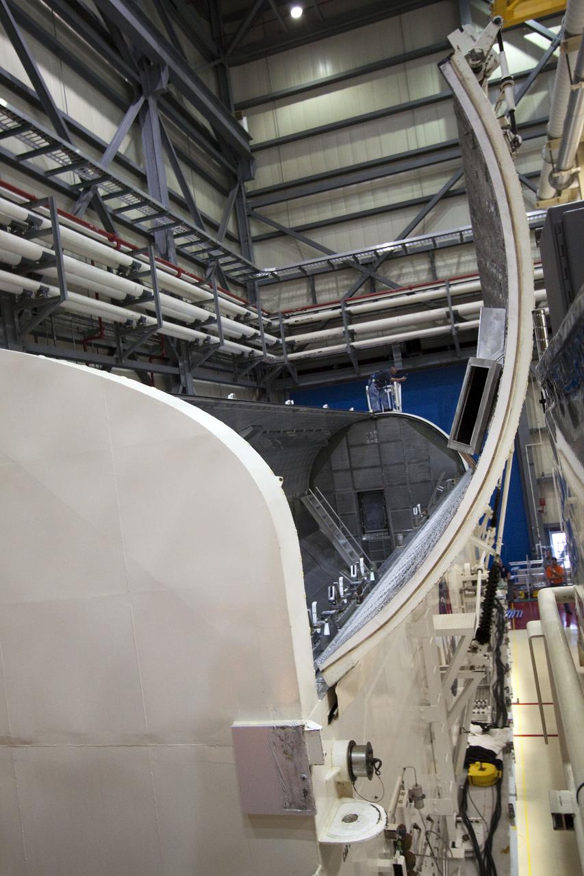 CAPE CANAVERAL, Fla. - In Orbiter Processing Facility-3 at NASA's Kennedy Space Center in Florida, space shuttle Discovery's payload bay doors are opened for the removal of the multi-purpose logistics module Leonardo and an ammonia tank assembly.  Discovery landed on Runway 33 at Kennedy's Shuttle Landing Facility at 9:08 a.m. EDT April 20 after 15 days in space, completing the more than 6.2-million-mile STS-131 mission on orbit 238.  The seven-member STS-131 crew carried the multi-purpose logistics module Leonardo, filled with supplies, a new crew sleeping quarters and science racks that were transferred to the International Space Station's laboratories.  Leonardo now will be modified into a permanent multi-purpose module, or PMM, and left aboard the station on space shuttle Discovery's STS-133 mission, targeted for launch Sept. 16.  For information on the STS-131 mission, visit http:__www.nasa.gov_mission_pages_shuttle_shuttlemissions_sts131_index.html.  For information on the STS-133 mission, visit http:__www.nasa.gov_mission_pages_shuttle_shuttlemissions_sts133_index.html.  Photo credit: NASA_Jack Pfaller
