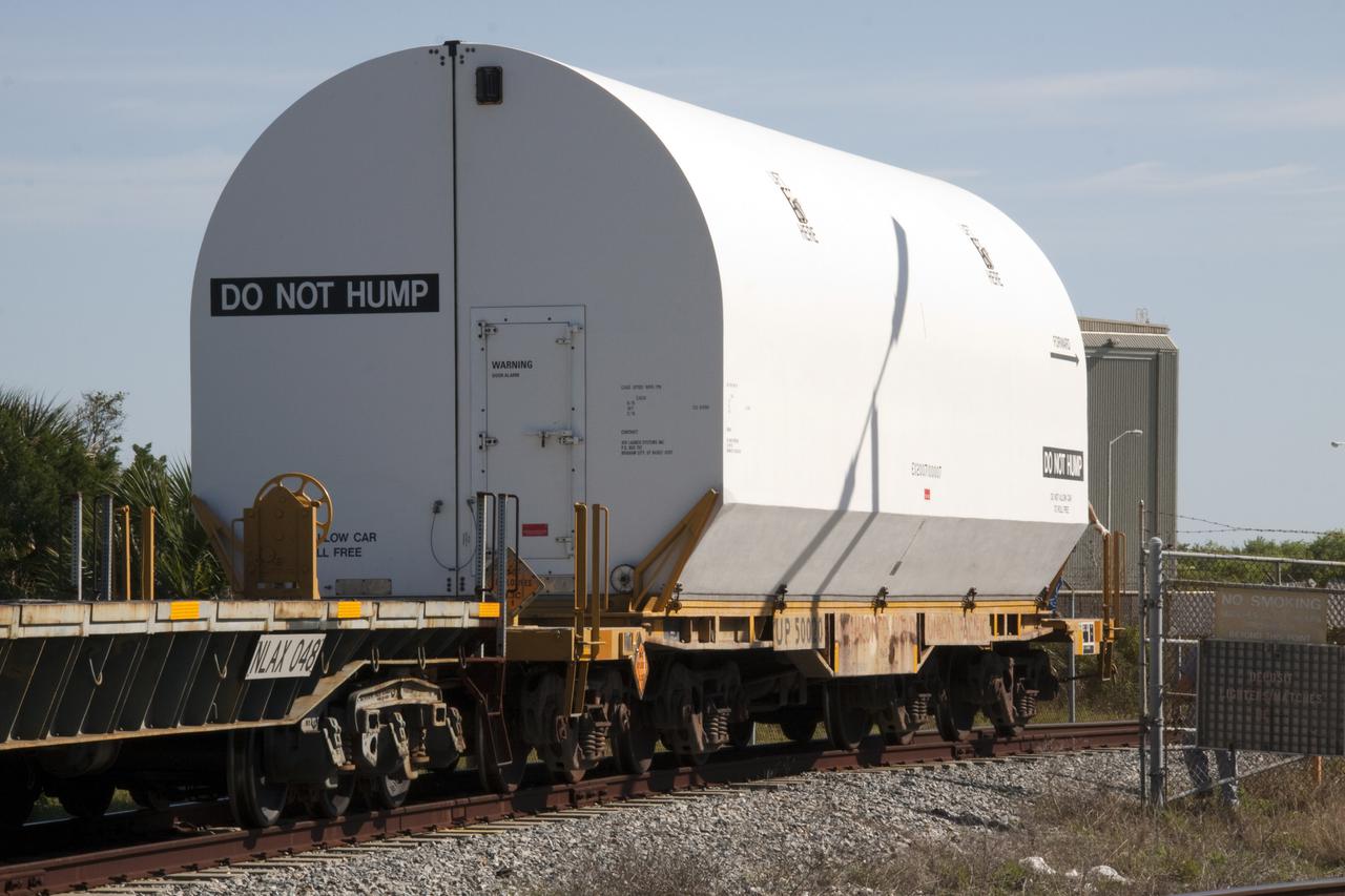 CAPE CANAVERAL, Fla. – Secured inside a railway car, a nozzle exit cone for a solid rocket booster that will be used on space shuttle Discovery's STS-133 mission is moved from Suspect Siding, a parking area, to the Rotation, Processing and Surge Facility at NASA's Kennedy Space Center in Florida. The boosters are manufactured by Alliant Techsystems Inc., or ATK. EGandG_URS runs Kennedy's railway system for NASA. Photo credit: NASA_Troy Cryder