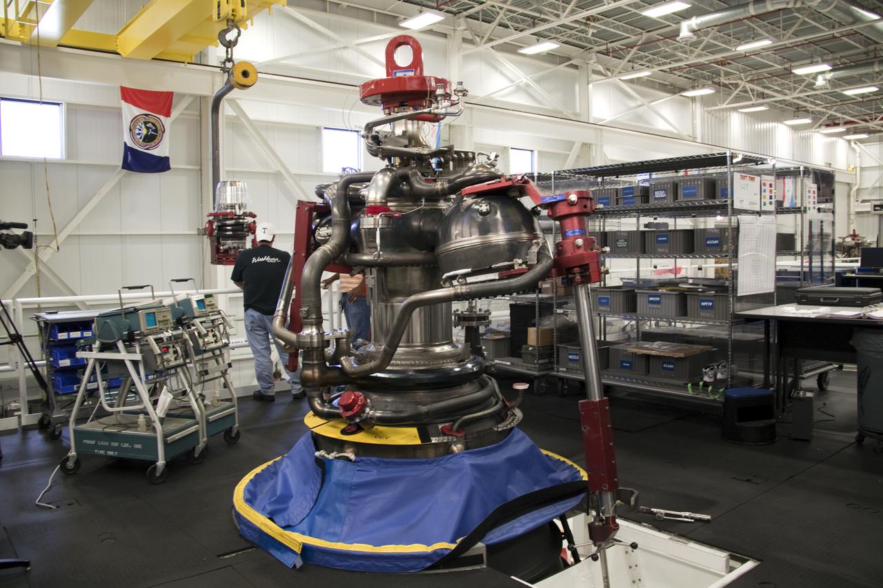 CAPE CANAVERAL, Fla. – In the Space Shuttle Main Engine Processing Facility at NASA's Kennedy Space Center in Florida, preparations are under way to install a high pressure oxidizer turbo pump on space shuttle main engine no. 2062, seen here.  The engine, or SSME, is the last one scheduled to be built at Kennedy by Pratt and Whitney Rocketdyne before the end of the Space Shuttle Program.  Three main engines are clustered at the aft end of the shuttle and have a combined thrust of more than 1.2 million pounds.  Even though an SSME weighs one-seventh as much as a locomotive engine, its high-pressure fuel pump alone delivers as much horsepower as 28 locomotives.  Each engine operates during the entire eight-and-a-half minute climb to orbit.  Post-flight inspections and maintenance of each engine also are conducted in the SSME Processing Facility between shuttle missions.  Photo credit: NASA_Amanda Diller