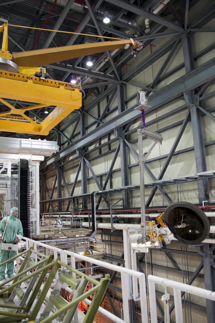 CAPE CANAVERAL, Fla. -- Technicians prepare to install a new Ku-Band communications system antenna on space shuttle Discovery in Orbiter Processing Facility-3 at NASA's Kennedy Space Center in Florida. The antenna is used to transmit and receive high data rate communications, such as video, and is being replaced for the STS-133 mission to the International Space Station.  During its STS-131 mission to the station in April, Discovery's Ku-Band failed to operate in orbit. As a result, video of the thermal protection system inspection had to be recorded aboard Discovery and transmitted to the ground after the shuttle docked with the station. Typically, the inspection video is simultaneously transmitted live to the ground and recorded aboard the shuttle for later review. NASA_Charisse Nahser