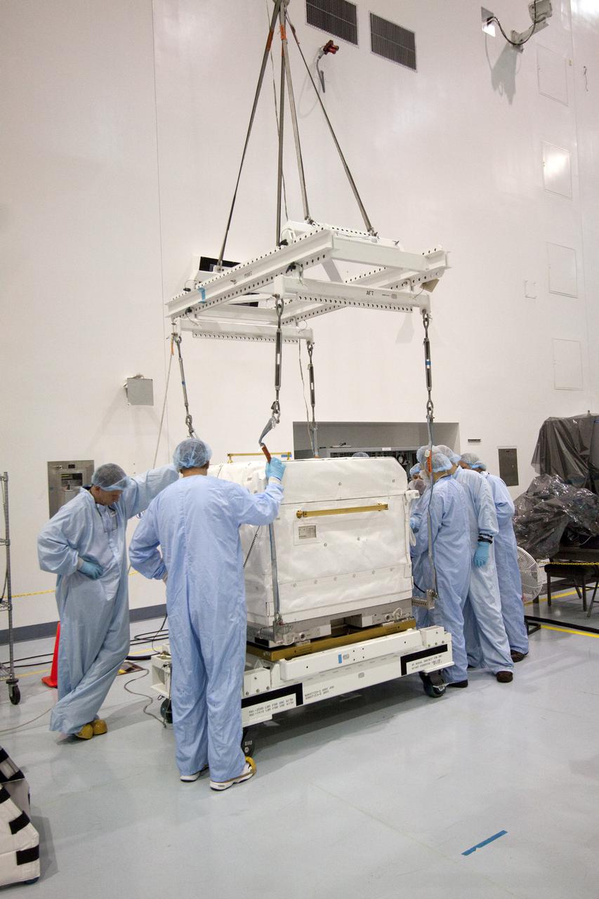 CAPE CANAVERAL, Fla. - In the Space Station Processing Facility at NASA's Kennedy Space Center in Florida, preparations are under way to move a cargo transport container to the ExPRESS Logistics Carrier-3, or ELC-3, on which it will be installed. The ELC-3 and the Alpha Magnetic Spectrometer are the primary payloads on space shuttle Endeavour's STS-134 mission to the International Space Station. Spare parts, including two S-band communications antennas; a high pressure gas tank; replacement parts for Dextre, the robotic hand on the station; and micrometeoroid debris shields, also will be delivered to the station. Endeavour's launch is targeted for mid-November. For information on the STS-134 mission, visit http:__www.nasa.gov_mission_pages_shuttle_shuttlemissions_sts134_index.html. Photo credit: NASA_Jack Pfaller