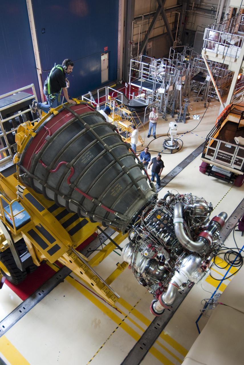 CAPE CANAVERAL, Fla. - In Orbiter Processing Facility-3 at NASA's Kennedy Space Center in Florida, one of three main engines on space shuttle Discovery has been removed using a specially designed Hyster engine lift. Inspection and maintenance of each main engine is standard procedure following a shuttle mission. Discovery next will deliver NASA's Permanent Multi-purpose Module, or PMM, the Express Logistics Carrier 4, and critical spare parts to the International Space Station on the STS-133 mission. Launch is targeted for fall 2010. Photo credit: NASA_Cory Huston