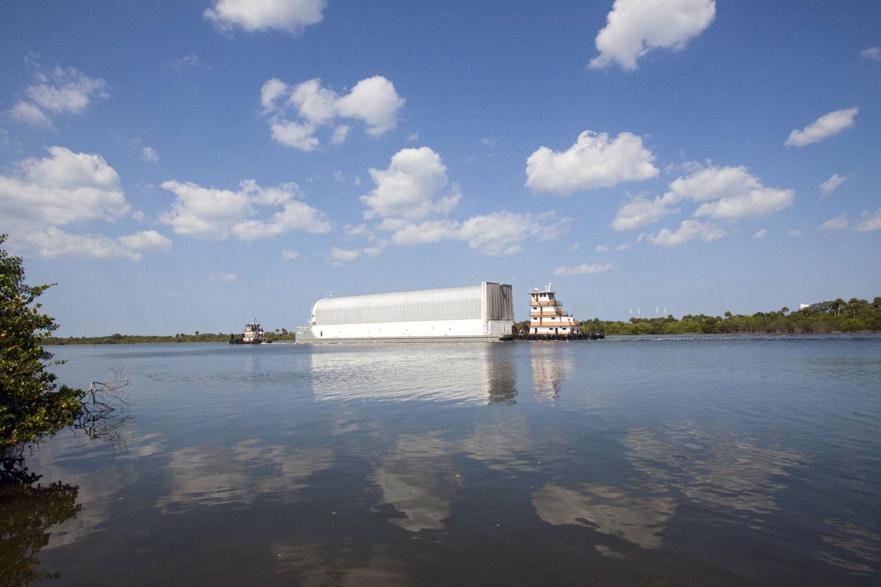 CAPE CANAVERAL, Fla. - Tugboats guide the Pegasus barge containing the external fuel tank for space shuttle Discovery's STS-133 mission through the Banana River to NASA's Kennedy Space Center in Florida.  On the STS-133 mission, Discovery will deliver NASA's Permanent Multi-purpose Module, or PMM, the Express Logistics Carrier 4, and critical spare parts to the International Space Station. Launch is targeted for fall 2010.  Photo credit: NASA_Jack Pfaller