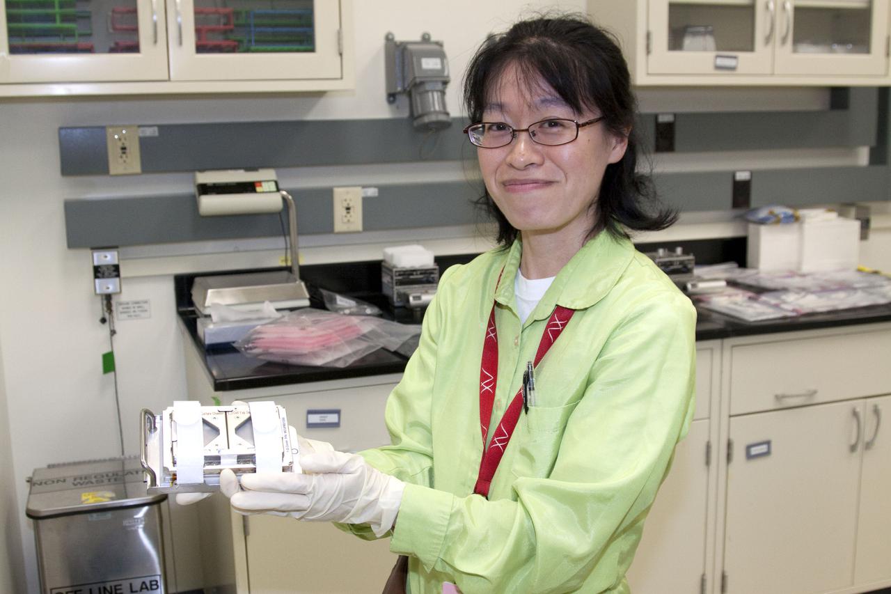 CAPE CANAVERAL, Fla. - In the Space Station Processing Facility at NASA's Kennedy Space Center in Florida, Japan Aerospace Exploration Agency scientist, Yano Sachiko, prepares the fish scale experiment for its flight to the International Space Station aboard the STS-132 mission. Expedition crew members aboard the station will examine regenerating scales collected from anesthetized goldfish in microgravity using the Cell Biology Experiment Facility, or CBEF, and the results will be compared with ground controls. In mammals, bone is formed and maintained by continuous remodeling through bone resorption called osteoclasts, and subsequent new bone formation called osteoblasts. The experiment will use osteoclasts and osteoblasts to examine the effect of microgravity on bone metabolism. Photo credit: NASA_Jack Pfaller