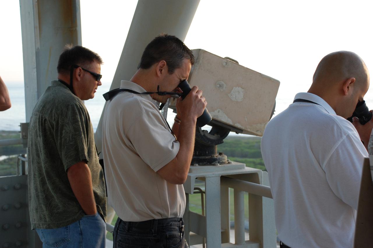 CAPE CANAVERAL, Fla. - At Launch Pad 39A at NASA's Kennedy Space Center in Florida, Tom Ford, center, NASA Final Inspection Team lead, inspects the pad for any foreign object debris.  Any object inadvertently left on the pad structure, no matter how small it may be, has the potential to cause a problem as space shuttle Atlantis lifts off.  Launch of the STS-132 mission is set for 2:20 p.m. EDT on May 14.  The six-member STS-132 crew will deliver the Russian-built Mini Research Module-1 to the International Space Station.  Named Rassvet, Russian for 'dawn,' the module is the second in a series of new pressurized components for Russia and will be permanently attached to the Earth-facing port of the Zarya control module.  Rassvet will be used for cargo storage and will provide an additional docking port to the station. Also aboard Atlantis is an Integrated Cargo Carrier, or ICC, an unpressurized flat bed pallet and keel yoke assembly used to support the transfer of exterior cargo from the shuttle to the station.  STS-132 is the 34th mission to the station and the last scheduled flight for Atlantis. For more information on the STS-132 mission objectives, payload and crew, visit http:__www.nasa.gov_mission_pages_shuttle_shuttlemissions_sts132_index.html. Photo Credit: NASA_Ben Smegelsky