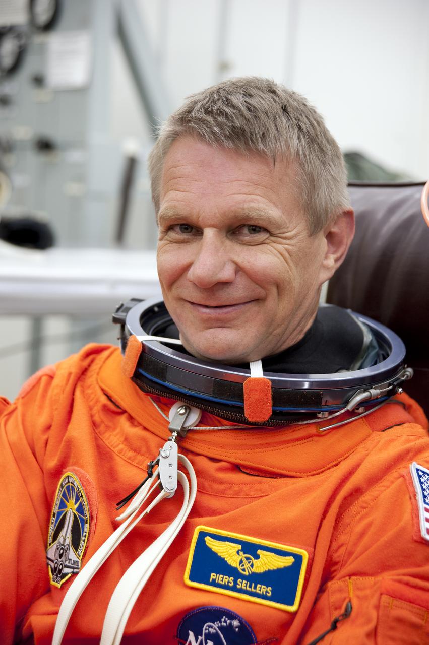 CAPE CANAVERAL, Fla. - In the Operations and Checkout Building at NASA's Kennedy Space Center in Florida, the astronauts of space shuttle Atlantis' STS-132 crew put on their launch-and-entry suits before heading to the Astrovan for the ride to Launch Pad 39A. Mission Specialist Piers Sellers, seen here, is making his third spaceflight.  Liftoff of the STS-132 mission is set for 2:20 p.m. EDT on May 14.  The six-member STS-132 crew will deliver the Russian-built Mini Research Module-1 to the International Space Station.  Named Rassvet, Russian for 'dawn,' the module is the second in a series of new pressurized components for Russia and will be permanently attached to the Earth-facing port of the Zarya control module.  Rassvet will be used for cargo storage and will provide an additional docking port to the station. Also aboard Atlantis is an Integrated Cargo Carrier, or ICC, an unpressurized flat bed pallet and keel yoke assembly used to support the transfer of exterior cargo from the shuttle to the station.  STS-132 is the 34th mission to the station and the last scheduled flight for Atlantis. For more information on the STS-132 mission objectives, payload and crew, visit http:__www.nasa.gov_mission_pages_shuttle_shuttlemissions_sts132_index.html. Photo Credit: NASA_Kim Shiflett