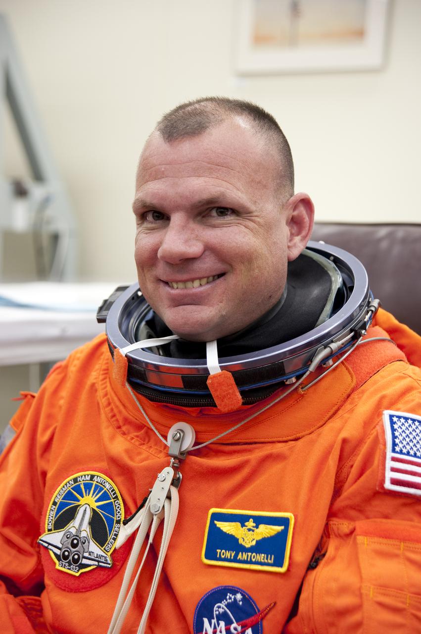 CAPE CANAVERAL, Fla. - In the Operations and Checkout Building at NASA's Kennedy Space Center in Florida, the astronauts of space shuttle Atlantis' STS-132 crew put on their launch-and-entry suits before heading to the Astrovan for the ride to Launch Pad 39A.  Pilot Tony Antonelli, seen here, is making his second spaceflight.  Liftoff of the STS-132 mission is set for 2:20 p.m. EDT on May 14.  The six-member STS-132 crew will deliver the Russian-built Mini Research Module-1 to the International Space Station.  Named Rassvet, Russian for 'dawn,' the module is the second in a series of new pressurized components for Russia and will be permanently attached to the Earth-facing port of the Zarya control module.  Rassvet will be used for cargo storage and will provide an additional docking port to the station. Also aboard Atlantis is an Integrated Cargo Carrier, or ICC, an unpressurized flat bed pallet and keel yoke assembly used to support the transfer of exterior cargo from the shuttle to the station.  STS-132 is the 34th mission to the station and the last scheduled flight for Atlantis. For more information on the STS-132 mission objectives, payload and crew, visit http:__www.nasa.gov_mission_pages_shuttle_shuttlemissions_sts132_index.html. Photo Credit: NASA_Kim Shiflett
