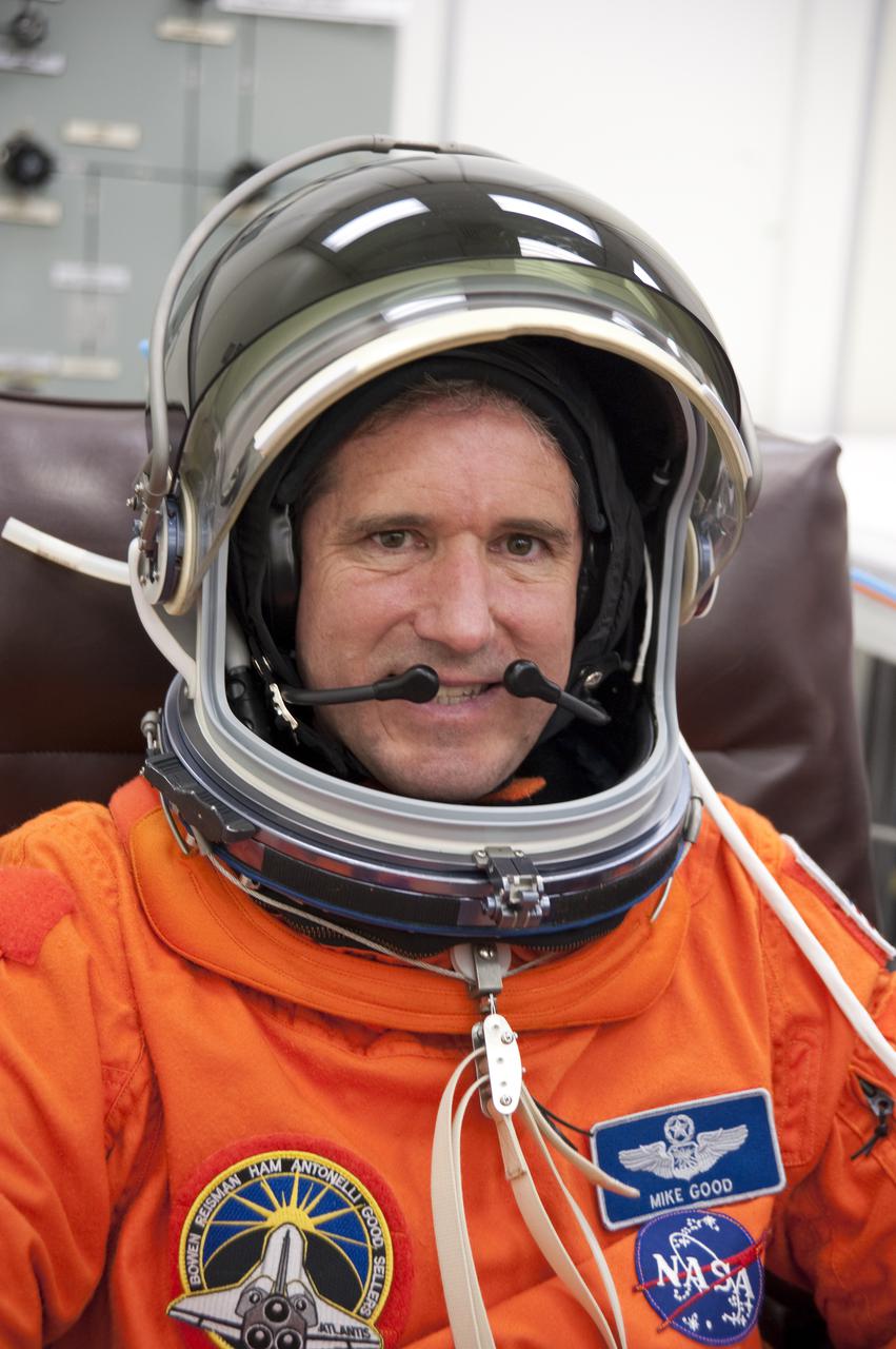CAPE CANAVERAL, Fla. - In the Operations and Checkout Building at NASA's Kennedy Space Center in Florida, the astronauts of space shuttle Atlantis' STS-132 crew put on their launch-and-entry suits before heading to the Astrovan for the ride to Launch Pad 39A.  Mission Specialist Michael Good, seen here checking out his helmet, is making his second spaceflight.  The Russian-built Mini Research Module-1 known as Rassvet, or 'dawn,' is inside the shuttle's cargo bay. It will provide additional storage space and a new docking port for Russian Soyuz and Progress spacecraft. The laboratory will be attached to the bottom port of the station's Zarya module.  The mission's three spacewalks will focus on storing spare components outside the station, including six batteries, a communications antenna and parts for the Canadian Dextre robotic arm.  STS-132 is the 132nd shuttle flight, the 32nd for Atlantis and the 34th shuttle mission dedicated to station assembly and maintenance. For more information on the STS-132 mission objectives, payload and crew, visit www.nasa.gov_mission_pages_shuttle_shuttlemissions_sts132_index.html. Photo Credit: NASA_Kim Shiflett