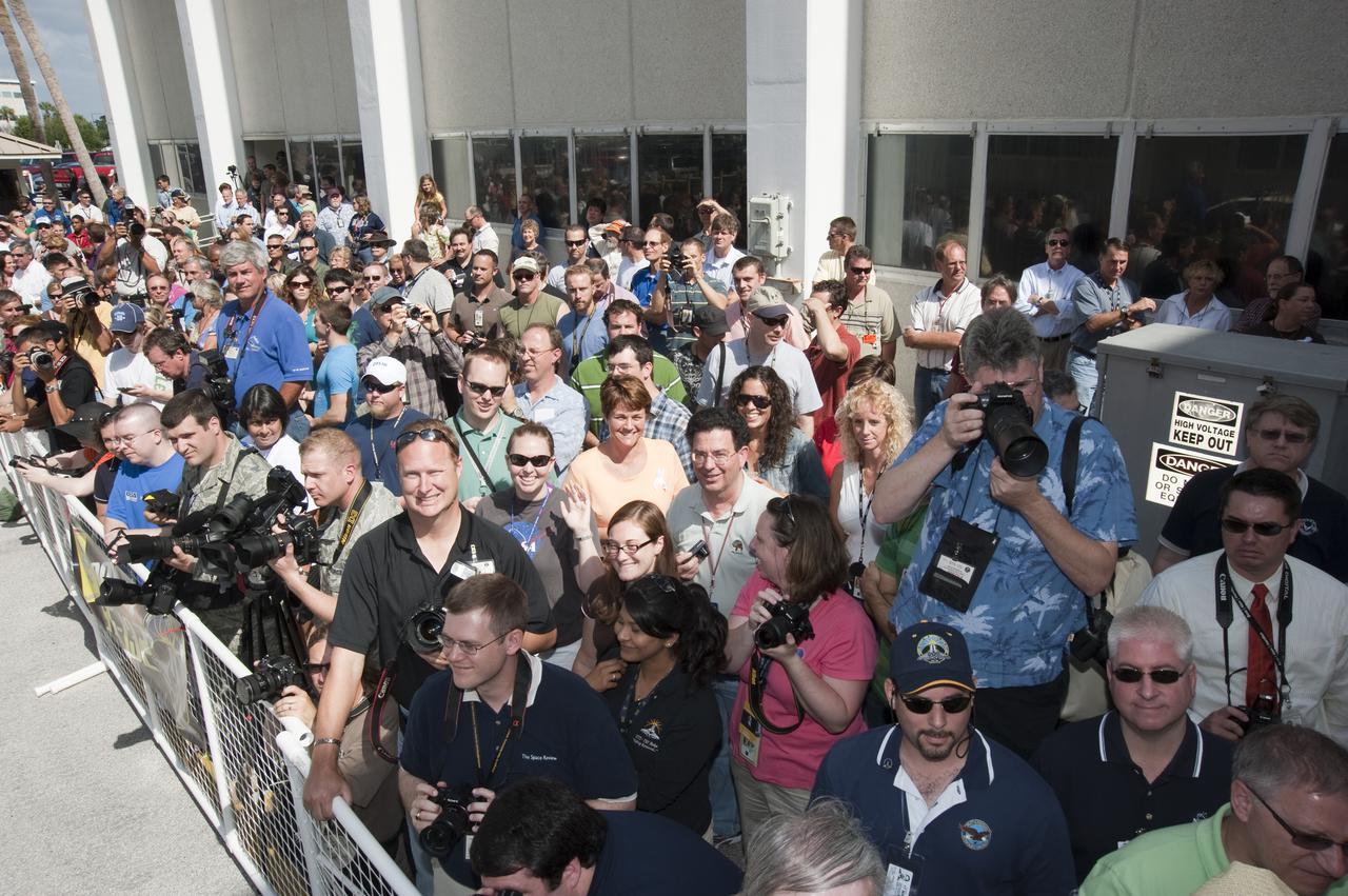 CAPE CANAVERAL, Fla. - At NASA's Kennedy Space Center in Florida, news media representatives and other spectators are on hand to cheer on the astronauts on space shuttle Atlantis' STS-132 crew as they walk out of the Operations and Checkout Building for the ride in the Astrovan to Launch Pad 39A. Liftoff of the STS-132 mission is set for 2:20 p.m. EDT on May 14. The six-member STS-132 crew will deliver the Russian-built Mini Research Module-1 to the International Space Station. Named Rassvet, Russian for 'dawn,' the module is the second in a series of new pressurized components for Russia and will be permanently attached to the Earth-facing port of the Zarya control module. Rassvet will be used for cargo storage and will provide an additional docking port to the station. Also aboard Atlantis is an Integrated Cargo Carrier, or ICC, an unpressurized flat bed pallet and keel yoke assembly used to support the transfer of exterior cargo from the shuttle to the station. STS-132 is the 34th mission to the station and the last scheduled flight for Atlantis. For more information on the STS-132 mission objectives, payload and crew, visit http:__www.nasa.gov_mission_pages_shuttle_shuttlemissions_sts132_index.html. Photo Credit: NASA_Kim Shiflett