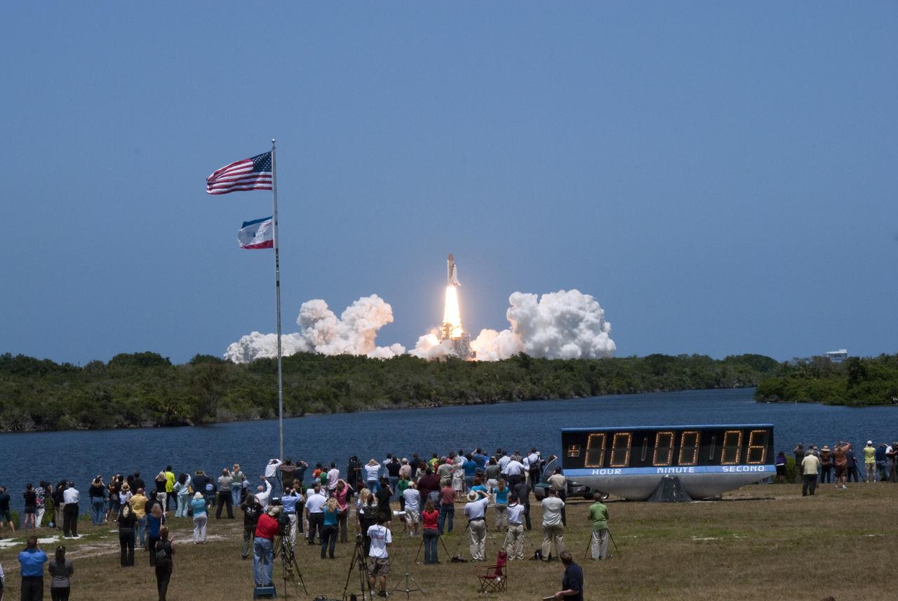 CAPE CANAVERAL, Fla. - Space shuttle Atlantis' liftoff from Launch Pad 39A at NASA's Kennedy Space Center in Florida is witnessed by news media representatives and STS-132 Tweetup participants on hand by the countdown clock at the Press Site.  Launch of the STS-132 mission was at 2:20 p.m. EDT on May 14.  The six-member crew will deliver the Russian-built Mini Research Module-1 to the International Space Station.  Named Rassvet, Russian for 'dawn,' the module is the second in a series of new pressurized components for Russia and will be permanently attached to the Earth-facing port of the Zarya control module.  Rassvet will be used for cargo storage and will provide an additional docking port to the station. Also aboard Atlantis is an Integrated Cargo Carrier, or ICC, an unpressurized flat bed pallet and keel yoke assembly used to support the transfer of exterior cargo from the shuttle to the station.  STS-132 is the 34th mission to the station and the last scheduled flight for Atlantis. For more information on the STS-132 mission objectives, payload and crew, visit http:__www.nasa.gov_mission_pages_shuttle_shuttlemissions_sts132_index.html. Photo Credit: NASA_Jim Grossmann