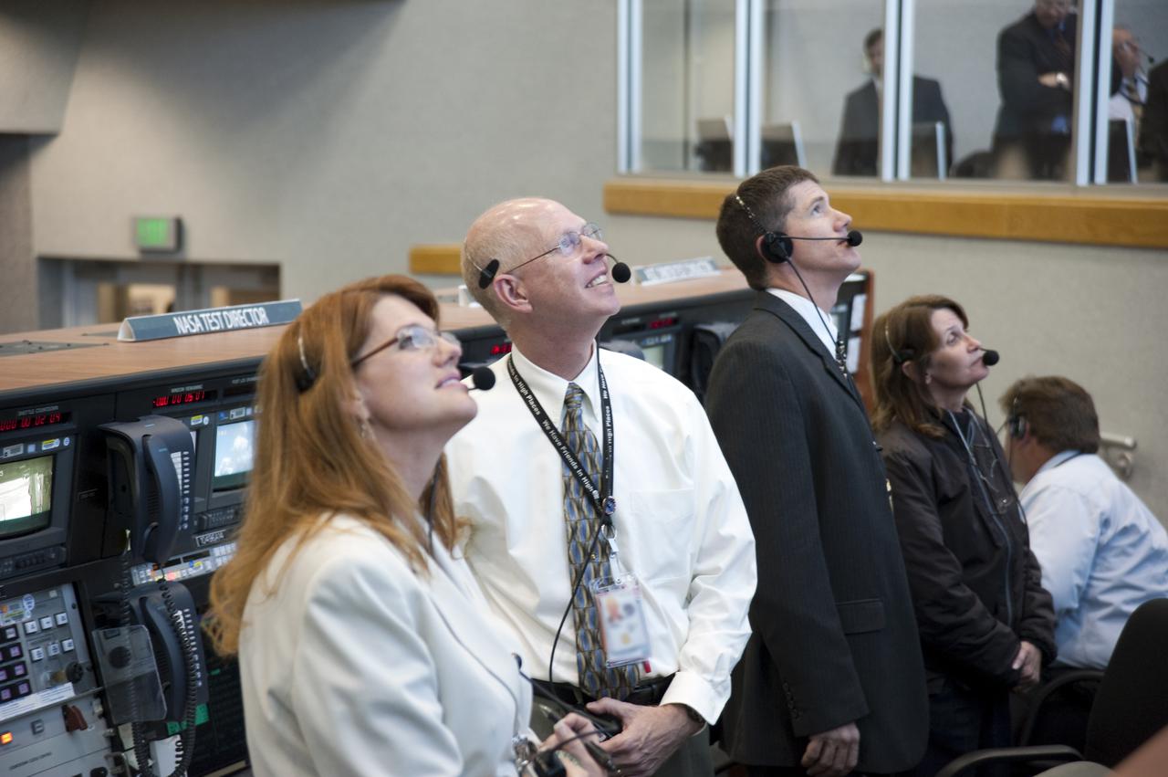 CAPE CANAVERAL, Fla. -- NASA test directors, from left, Charlie Blackwell-Thompson, Steve Payne and Jeremy Graeber, and Orbiter Test Conductor Teresa Annulis, watch space shuttle Atlantis lift off on its STS-132 mission to the International Space Station through the windows of Firing Room 4 of the Launch Control Center at NASA's Kennedy Space Center in Florida. Launch was on time at 2:20 p.m. EDT. STS-132 is the 132nd shuttle flight, the 32nd for Atlantis and the 34th shuttle mission dedicated to station assembly and maintenance. For more information on the STS-132 mission objectives, payload and crew, visit www.nasa.gov_mission_pages_shuttle_shuttlemissions_sts132_index.html. Photo credit: NASA_Kim Shiflett