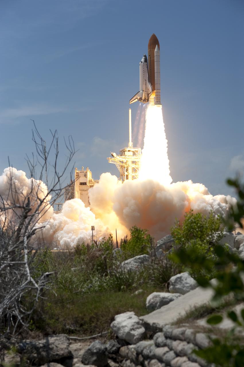 CAPE CANAVERAL, Fla. - Space shuttle Atlantis rumbles the Space Coast as it clears the tower at its pristine launch complex, which is home to the Merritt Island National Wildlife Refuge. Liftoff from NASA Kennedy Space Center's Launch Pad 39A occurred right on time at 2:20 p.m. EDT on May 14.  Atlantis' primary payload for the STS-132 mission is the Russian-built Mini Research Module-1, which will provide additional storage space and a new docking port for Russian Soyuz and Progress spacecraft aboard the International Space Station. STS-132 is the 132nd shuttle flight, the 32nd for Atlantis and the 34th shuttle mission dedicated to station assembly and maintenance. For more information on the STS-132 mission objectives, payload and crew, visit www.nasa.gov_mission_pages_shuttle_shuttlemissions_sts132_index.html. Photo credit: NASA_Sandra Joseph and Kevin O'Connell