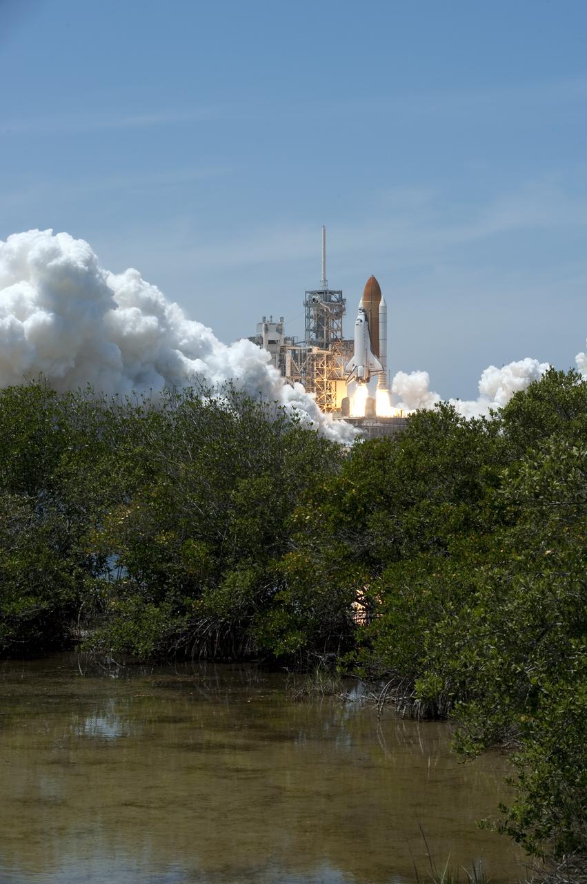 CAPE CANAVERAL, Fla. - Space shuttle Atlantis rumbles the Space Coast as it lifts off its pristine launch complex, which is home to the Merritt Island National Wildlife Refuge. Launch from NASA Kennedy Space Center's Launch Pad 39A occurred right on time at 2:20 p.m. EDT on May 14.  Atlantis' primary payload for the STS-132 mission is the Russian-built Mini Research Module-1, which will provide additional storage space and a new docking port for Russian Soyuz and Progress spacecraft aboard the International Space Station. STS-132 is the 132nd shuttle flight, the 32nd for Atlantis and the 34th shuttle mission dedicated to station assembly and maintenance. For more information on the STS-132 mission objectives, payload and crew, visit www.nasa.gov_mission_pages_shuttle_shuttlemissions_sts132_index.html. Photo credit: NASA_Sandra Joseph and Kevin O'Connell