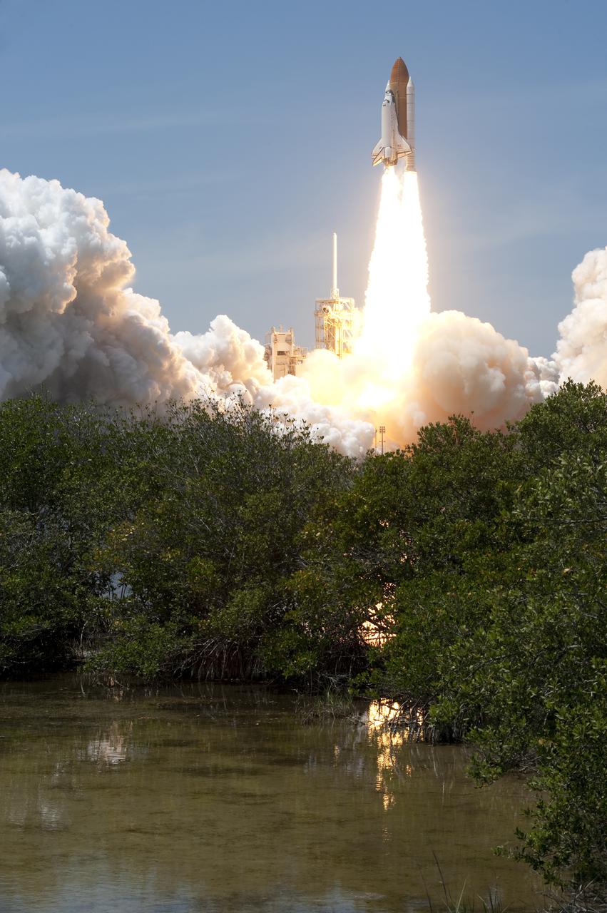 CAPE CANAVERAL, Fla. - Space shuttle Atlantis rumbles the Space Coast as it clears the tower at its pristine launch complex, which is home to the Merritt Island National Wildlife Refuge. Liftoff from NASA Kennedy Space Center's Launch Pad 39A occurred right on time at 2:20 p.m. EDT on May 14.  Atlantis' primary payload for the STS-132 mission is the Russian-built Mini Research Module-1, which will provide additional storage space and a new docking port for Russian Soyuz and Progress spacecraft aboard the International Space Station. STS-132 is the 132nd shuttle flight, the 32nd for Atlantis and the 34th shuttle mission dedicated to station assembly and maintenance. For more information on the STS-132 mission objectives, payload and crew, visit www.nasa.gov_mission_pages_shuttle_shuttlemissions_sts132_index.html. Photo credit: NASA_Sandra Joseph and Kevin O'Connell