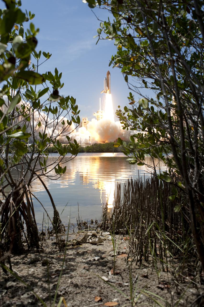 CAPE CANAVERAL, Fla. - Space shuttle Atlantis rumbles the Space Coast as it clears the tower at its pristine launch complex, which is home to the Merritt Island National Wildlife Refuge. Liftoff from NASA Kennedy Space Center's Launch Pad 39A occurred right on time at 2:20 p.m. EDT on May 14. Atlantis' primary payload for the STS-132 mission is the Russian-built Mini Research Module-1, which will provide additional storage space and a new docking port for Russian Soyuz and Progress spacecraft aboard the International Space Station. STS-132 is the 132nd shuttle flight, the 32nd for Atlantis and the 34th shuttle mission dedicated to station assembly and maintenance. For more information on the STS-132 mission objectives, payload and crew, visit www.nasa.gov_mission_pages_shuttle_shuttlemissions_sts132_index.html. Photo credit: NASA_Tony Gray and Tom Farrar