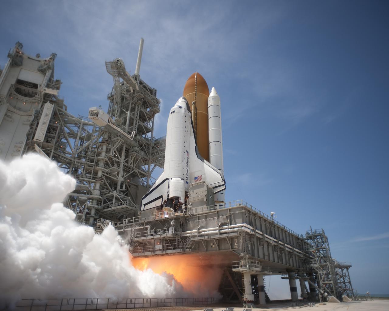 CAPE CANAVERAL, Fla. - At NASA's Kennedy Space Center in Florida, an exhaust plume forms under the mobile launcher platform on Launch Pad 39A as space shuttle Atlantis lifts off on the STS-132 mission at 2:20 p.m. EDT on May 14. Atlantis' primary payload for the STS-132 mission is the Russian-built Mini Research Module-1, which will provide additional storage space and a new docking port for Russian Soyuz and Progress spacecraft aboard the International Space Station. STS-132 is the 132nd shuttle flight, the 32nd for Atlantis and the 34th shuttle mission dedicated to station assembly and maintenance. For more information on the STS-132 mission objectives, payload and crew, visit www.nasa.gov_mission_pages_shuttle_shuttlemissions_sts132_index.html. Photo credit: NASA_Tony Gray and Tom Farrar