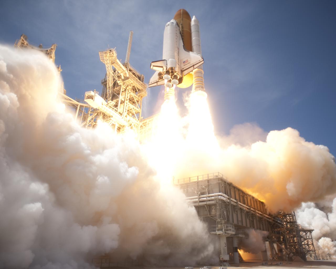 CAPE CANAVERAL, Fla. - At NASA's Kennedy Space Center in Florida, an exhaust plume builds on Launch Pad 39A as space shuttle Atlantis lifts off on the STS-132 mission at 2:20 p.m. EDT on May 14. Atlantis' primary payload for the STS-132 mission is the Russian-built Mini Research Module-1, which will provide additional storage space and a new docking port for Russian Soyuz and Progress spacecraft aboard the International Space Station. STS-132 is the 132nd shuttle flight, the 32nd for Atlantis and the 34th shuttle mission dedicated to station assembly and maintenance. For more information on the STS-132 mission objectives, payload and crew, visit www.nasa.gov_mission_pages_shuttle_shuttlemissions_sts132_index.html. Photo credit: NASA_Tony Gray and Tom Farrar