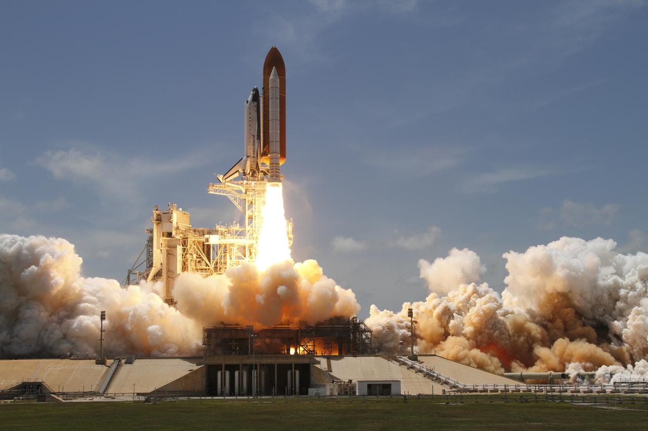 CAPE CANAVERAL, Fla. - At NASA's Kennedy Space Center in Florida, an exhaust plume forms under the mobile launcher platform on Launch Pad 39A as space shuttle Atlantis lifts off on the STS-132 mission to the International Space Station at 2:20 p.m. EDT on May 14.  STS-132 is the 132nd shuttle flight, the 32nd for Atlantis and the 34th shuttle mission dedicated to station assembly and maintenance. For more information on the STS-132 mission objectives, payload and crew, visit www.nasa.gov_mission_pages_shuttle_shuttlemissions_sts132_index.html. Photo courtesy of Scott Andrews