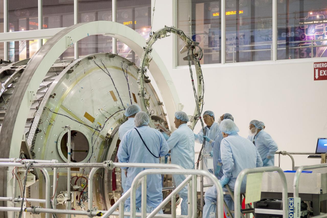 STS-133 COMMON BERTHING MECHANISIM (CMB) SIMULATOR HOIST & TEMPORARY INSTALL TO PERMANENT MULTIPURPOSE MODULE (PMM)