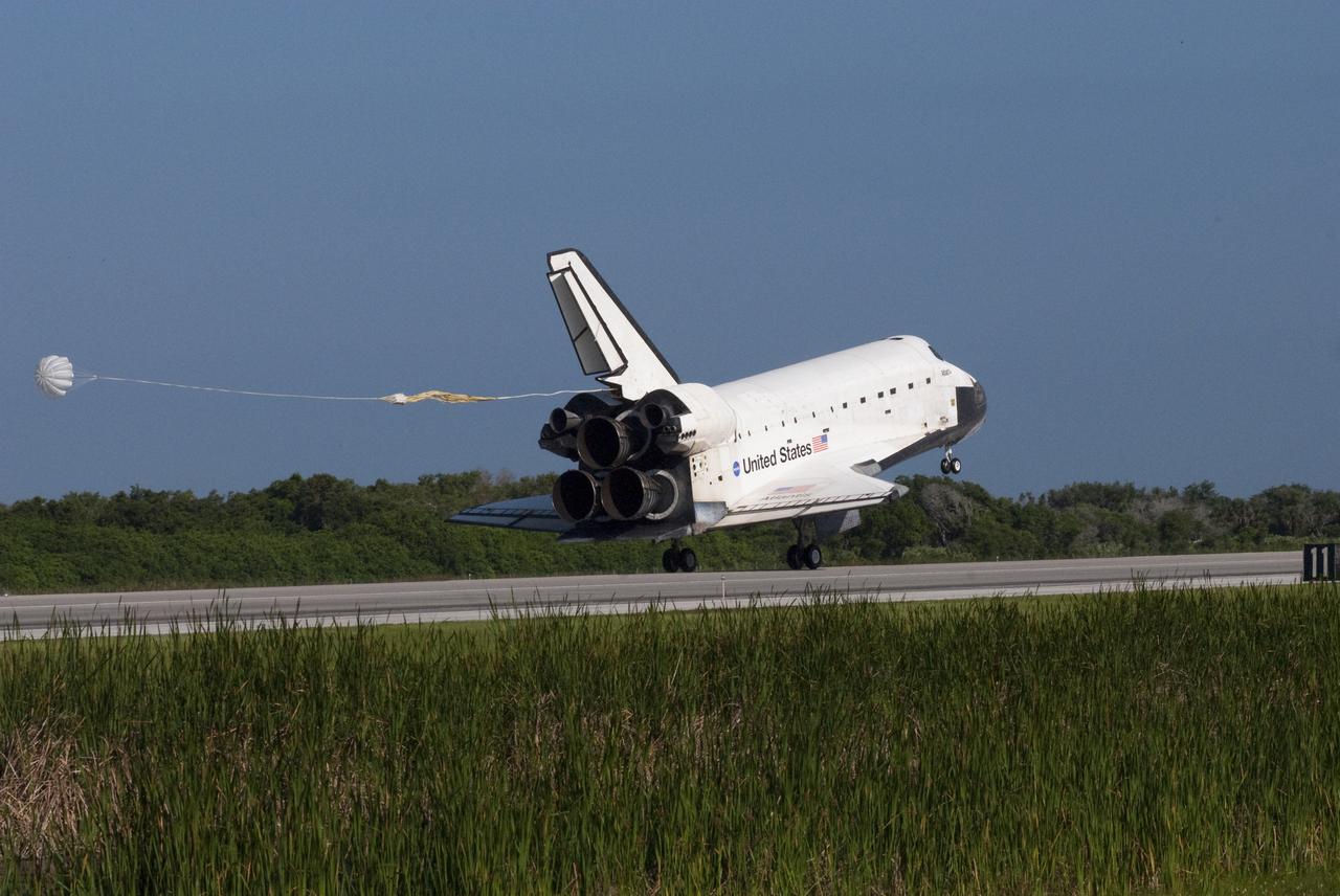 CAPE CANAVERAL, Fla. - Space shuttle Atlantis' drag chute deploys as the main gear touches down on Runway 33 at the Shuttle Landing Facility at NASA's Kennedy Space Center in Florida. Landing was at 8:48 a.m. EDT, completing the 12-day STS-132 mission to the International Space Station. Main gear touchdown was at 8:48:11 a.m. EDT, followed by nose gear touchdown at 8:48:21 a.m. and wheelstop at 8:49:18 a.m. On board are Commander Ken Ham, Pilot Tony Antonelli, Mission Specialists Garrett Reisman, Michael Good, Steve Bowen and Piers Sellers.   The six-member STS-132 crew carried the Russian-built Mini Research Module-1 to the International Space Station. STS-132 is the 34th shuttle mission to the station, the 132nd shuttle mission overall and the last planned flight for Atlantis. For information on the STS-132 mission and crew, visit www.nasa.gov_mission_pages_shuttle_shuttlemissions_sts132_index.html. Photo credit: NASA_Jim Grossmann