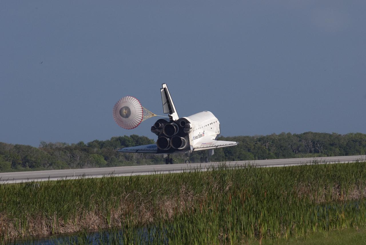 CAPE CANAVERAL, Fla. - The drag chute slows space shuttle Atlantis as it rolls down Runway 33 at the Shuttle Landing Facility at NASA's Kennedy Space Center in Florida. Landing was at 8:48 a.m. EDT, completing the 12-day STS-132 mission to the International Space Station. Main gear touchdown was at 8:48:11 a.m. EDT, followed by nose gear touchdown at 8:48:21 a.m. and wheelstop at 8:49:18 a.m. On board are Commander Ken Ham, Pilot Tony Antonelli, Mission Specialists Garrett Reisman, Michael Good, Steve Bowen and Piers Sellers.   The six-member STS-132 crew carried the Russian-built Mini Research Module-1 to the International Space Station. STS-132 is the 34th shuttle mission to the station, the 132nd shuttle mission overall and the last planned flight for Atlantis. For information on the STS-132 mission and crew, visit www.nasa.gov_mission_pages_shuttle_shuttlemissions_sts132_index.html. Photo credit: NASA_Jim Grossmann