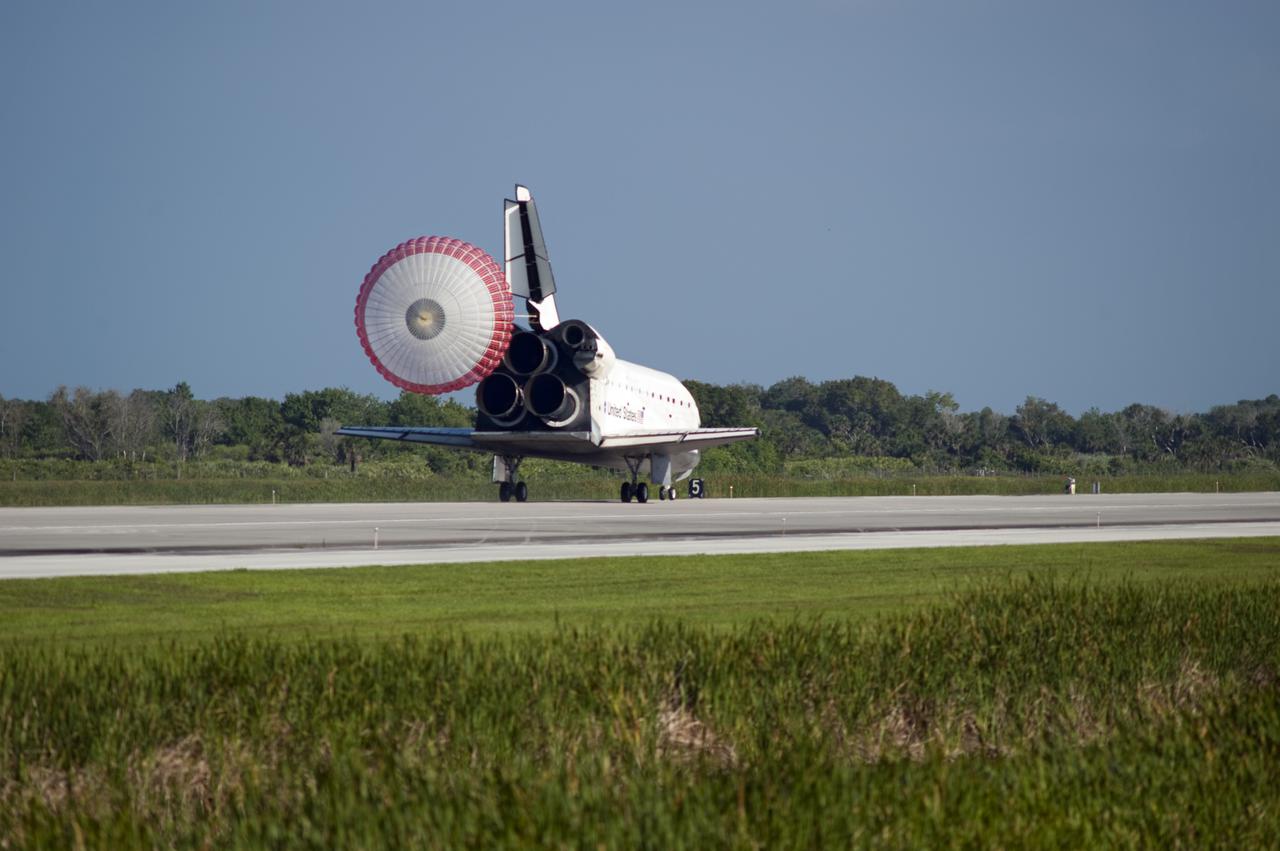 CAPE CANAVERAL, Fla. - Space shuttle Atlantis' drag chute slows the vehicle as it rolls to a stop on Runway 33 at the Shuttle Landing Facility at NASA's Kennedy Space Center in Florida. Landing was at 8:48 a.m. EDT, completing the 12-day STS-132 mission to the International Space Station.   The six-member STS-132 crew carried the Russian-built Mini Research Module-1 to the International Space Station. STS-132 is the 34th shuttle mission to the station, the 132nd shuttle mission overall and the last planned flight for Atlantis. For information on the STS-132 mission and crew, visit www.nasa.gov_mission_pages_shuttle_shuttlemissions_sts132_index.html. Photo credit: NASA_Tony Gray