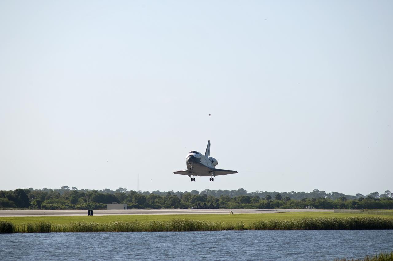 CAPE CANAVERAL, Fla. - A bird escorts space shuttle Atlantis toward Runway 33 at the Shuttle Landing Facility at NASA's Kennedy Space Center in Florida. Landing was at 8:48 a.m. EDT, completing the 12-day STS-132 mission to the International Space Station. The six-member STS-132 crew carried the Russian-built Mini Research Module-1 to the International Space Station. STS-132 is the 34th shuttle mission to the station, the 132nd shuttle mission overall and the last planned flight for Atlantis. For information on the STS-132 mission and crew, visit www.nasa.gov_mission_pages_shuttle_shuttlemissions_sts132_index.html. Photo credit: NASA_Rick Wetherington