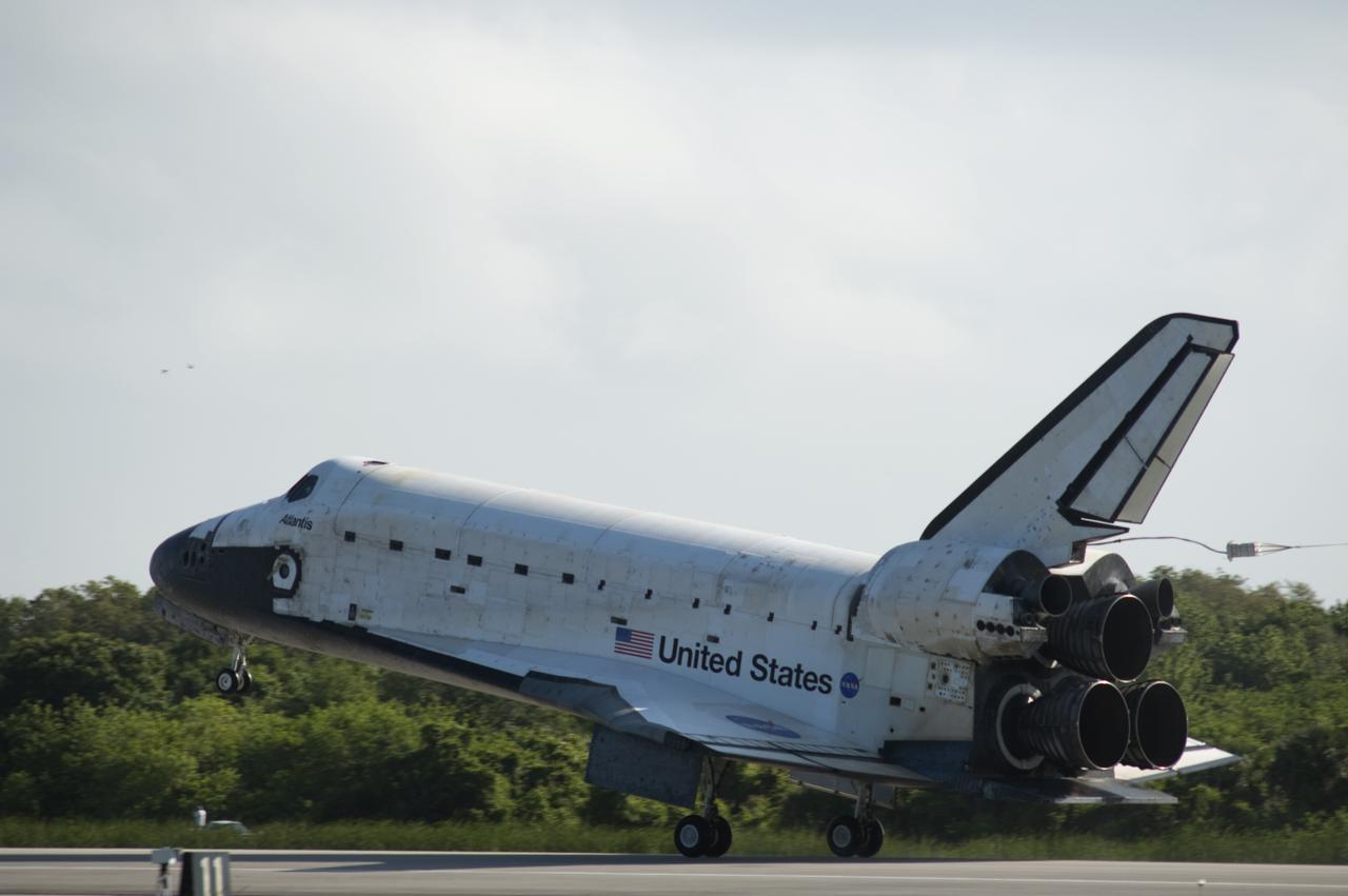 CAPE CANAVERAL, Fla. - Space shuttle Atlantis' main gear touches down on Runway 33 at the Shuttle Landing Facility at NASA's Kennedy Space Center in Florida. Landing was at 8:48 a.m. EDT, completing the 12-day STS-132 mission to the International Space Station. The six-member STS-132 crew carried the Russian-built Mini Research Module-1 to the International Space Station. STS-132 is the 34th shuttle mission to the station, the 132nd shuttle mission overall and the last planned flight for Atlantis. For information on the STS-132 mission and crew, visit www.nasa.gov_mission_pages_shuttle_shuttlemissions_sts132_index.html. Photo credit: NASA_Rick Wetherington