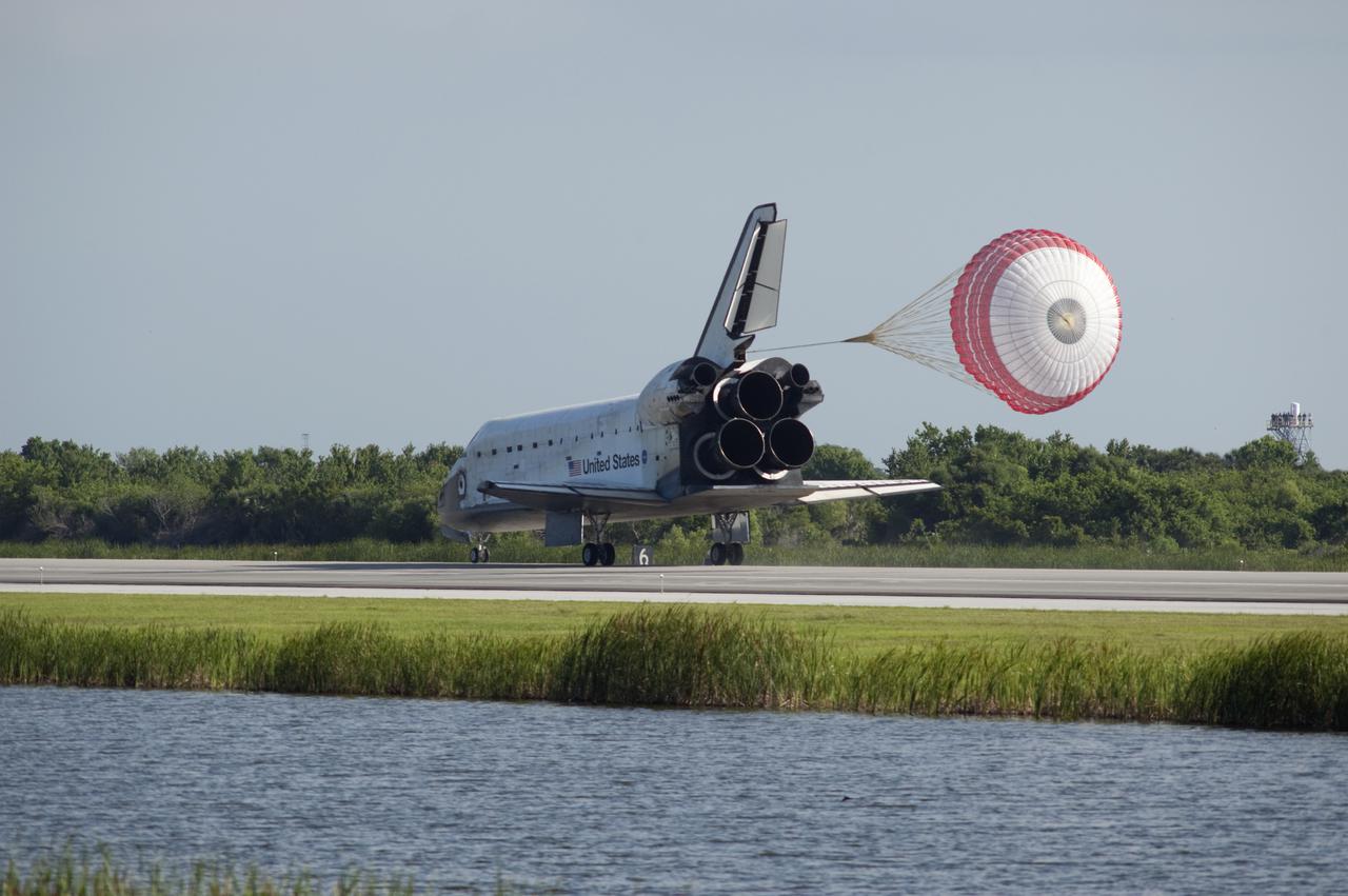 CAPE CANAVERAL, Fla. - Space shuttle Atlantis' drag chute slows the vehicle as it rolls down Runway 33 at the Shuttle Landing Facility at NASA's Kennedy Space Center in Florida. Landing was at 8:48 a.m. EDT, completing the 12-day STS-132 mission to the International Space Station.  The six-member STS-132 crew carried the Russian-built Mini Research Module-1 to the space station. STS-132 is the 34th shuttle mission to the station, the 132nd shuttle mission overall and the last planned flight for Atlantis. For information on the STS-132 mission and crew, visit www.nasa.gov_mission_pages_shuttle_shuttlemissions_sts132_index.html. Photo credit: NASA_Sandra Joseph