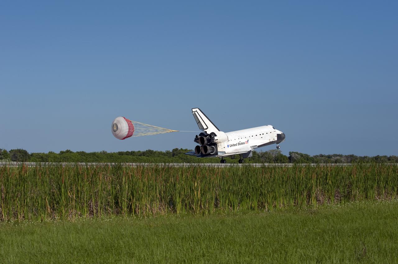 CAPE CANAVERAL, Fla. - Space shuttle Atlantis' drag chute slows the vehicle as it rolls down Runway 33 at the Shuttle Landing Facility at NASA's Kennedy Space Center in Florida. The shuttle approached from the southeast in a crystal-clear blue sky, giving the Space Coast quite a show. Landing was at 8:48 a.m. EDT, completing the 12-day STS-132 mission to the International Space Station. The six-member STS-132 crew carried the Russian-built Mini Research Module-1 to the space station. STS-132 is the 34th shuttle mission to the station, the 132nd shuttle mission overall and the last planned flight for Atlantis. For information on the STS-132 mission and crew, visit www.nasa.gov_mission_pages_shuttle_shuttlemissions_sts132_index.html. Photo credit: NASA_Kevin O'Connell