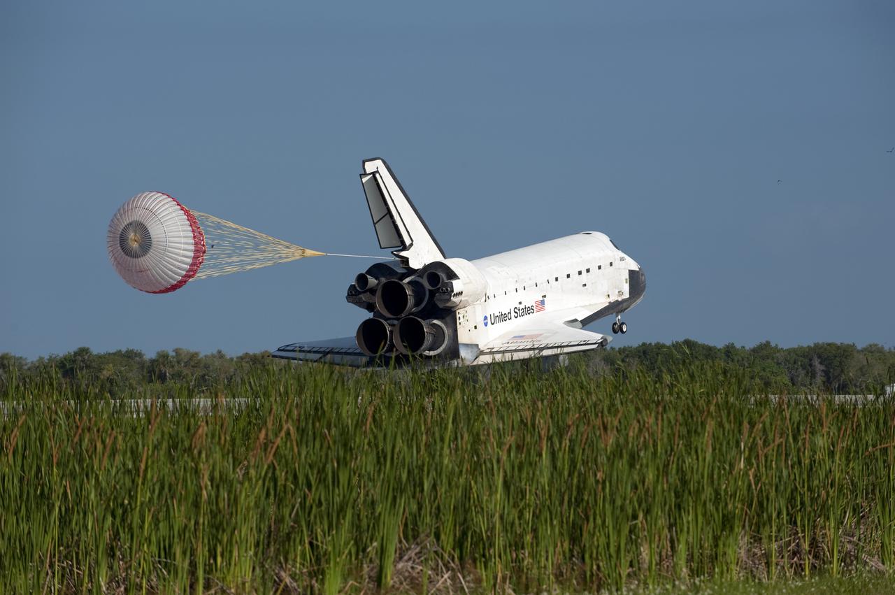 CAPE CANAVERAL, Fla. - Space shuttle Atlantis' drag chute slows the vehicle as it rolls down Runway 33 at the Shuttle Landing Facility at NASA's Kennedy Space Center in Florida. The shuttle approached from the southeast in a crystal-clear blue sky, giving the Space Coast quite a show. Landing was at 8:48 a.m. EDT, completing the 12-day STS-132 mission to the International Space Station. The six-member STS-132 crew carried the Russian-built Mini Research Module-1 to the space station. STS-132 is the 34th shuttle mission to the station, the 132nd shuttle mission overall and the last planned flight for Atlantis. For information on the STS-132 mission and crew, visit www.nasa.gov_mission_pages_shuttle_shuttlemissions_sts132_index.html. Photo credit: NASA_Kevin O'Connell