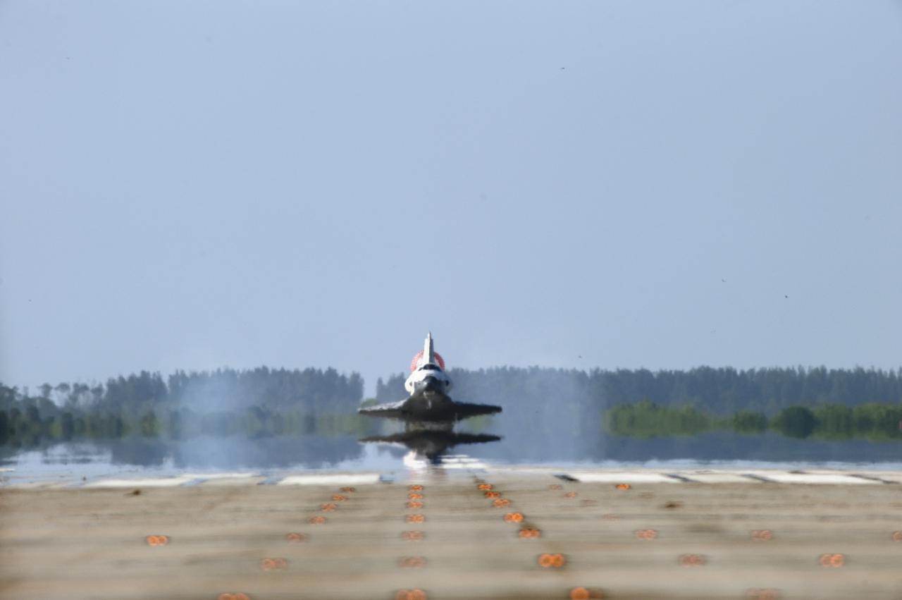 CAPE CANAVERAL, Fla. - Coming in from the southeast, space shuttle Atlantis touches down on Runway 33 at the Shuttle Landing Facility at NASA's Kennedy Space Center in Florida. Landing was at 8:48 a.m. EDT, completing the 12-day STS-132 mission to the International Space Station. The six-member STS-132 crew carried the Russian-built Mini Research Module-1 to the space station. STS-132 is the 34th shuttle mission to the station, the 132nd shuttle mission overall and the last planned flight for Atlantis. For information on the STS-132 mission and crew, visit www.nasa.gov_mission_pages_shuttle_shuttlemissions_sts132_index.html. Photo credit: NASA_Sandra Joseph and Carl Winebarger