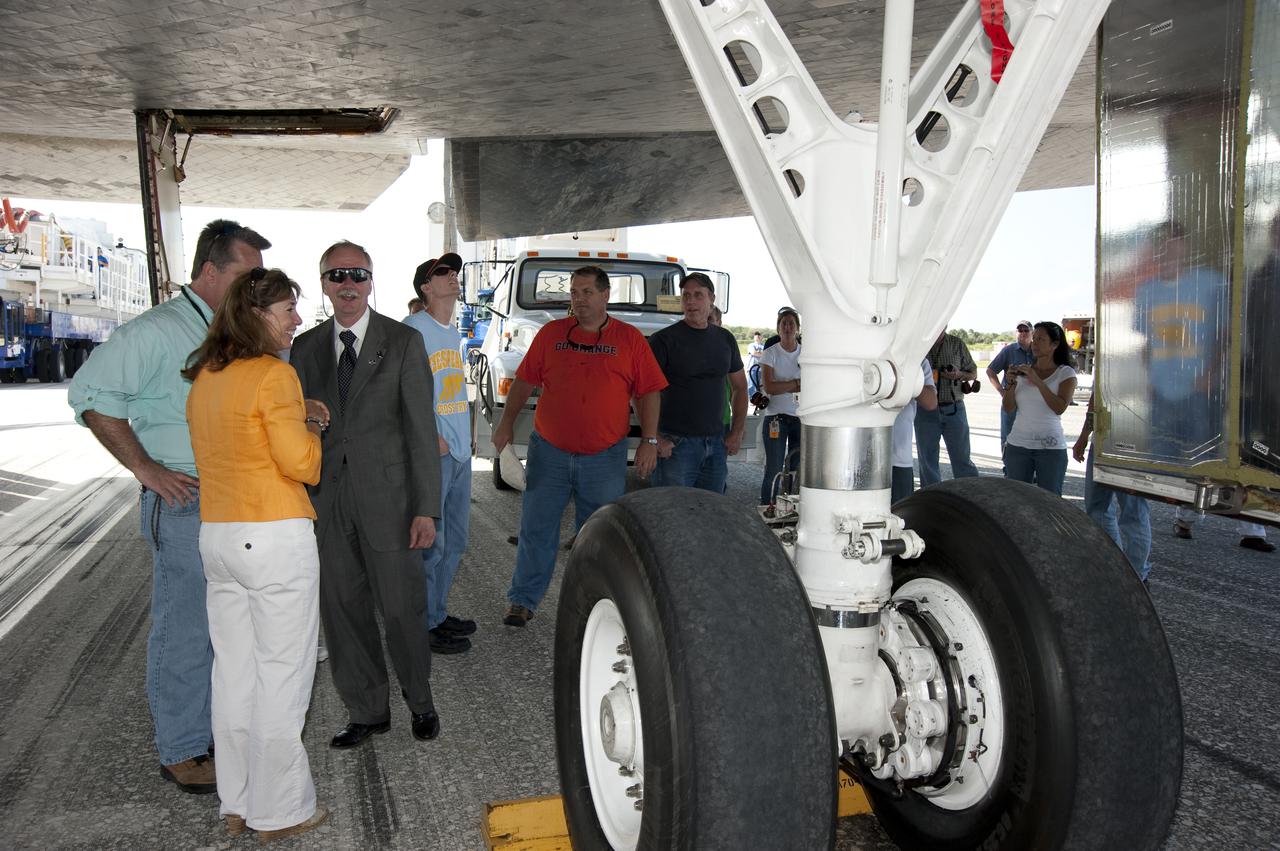 CAPE CANAVERAL, Fla. - At NASA's Kennedy Space Center in Florida, NASA Deputy Administrator Lori Garver and Associate Administrator for Space Operations Bill Gerstenmaier join workers under space shuttle Atlantis on the Shuttle Landing Facility. Atlantis wrapped up its 4.8-million-mile STS-132 mission to the International Space Station at 8:48 a.m. EDT The six-member STS-132 crew carried the Russian-built Mini Research Module-1 to the space station. STS-132 is the 34th shuttle mission to the station, the 132nd shuttle mission overall and the last planned flight for Atlantis. For information on the STS-132 mission and crew, visit www.nasa.gov_mission_pages_shuttle_shuttlemissions_sts132_index.html. Photo credit: NASA_Kim Shiflett