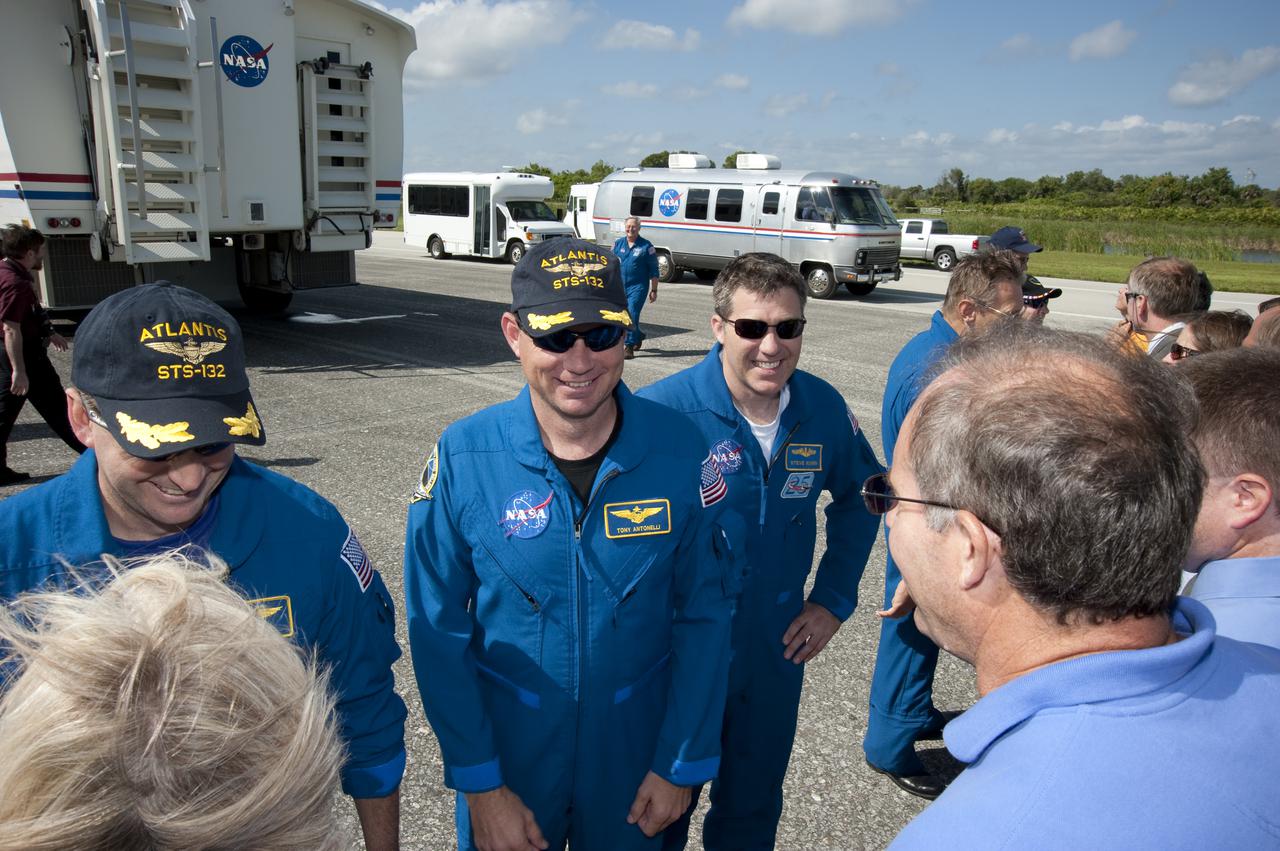 CAPE CANAVERAL, Fla. - At NASA's Kennedy Space Center in Florida, workers greet STS-132 Commander Ken Ham , left, Pilot Tony Antonelli and Mission Specialist Steve Bowen on the Shuttle Landing Facility. Atlantis wrapped up its 4.8-million-mile STS-132 mission to the International Space Station at 8:48 a.m. EDT. The six-member STS-132 crew carried the Russian-built Mini Research Module-1 to the space station. STS-132 is the 34th shuttle mission to the station, the 132nd shuttle mission overall and the last planned flight for Atlantis. For information on the STS-132 mission and crew, visit www.nasa.gov_mission_pages_shuttle_shuttlemissions_sts132_index.html. Photo credit: NASA_Kim Shiflett