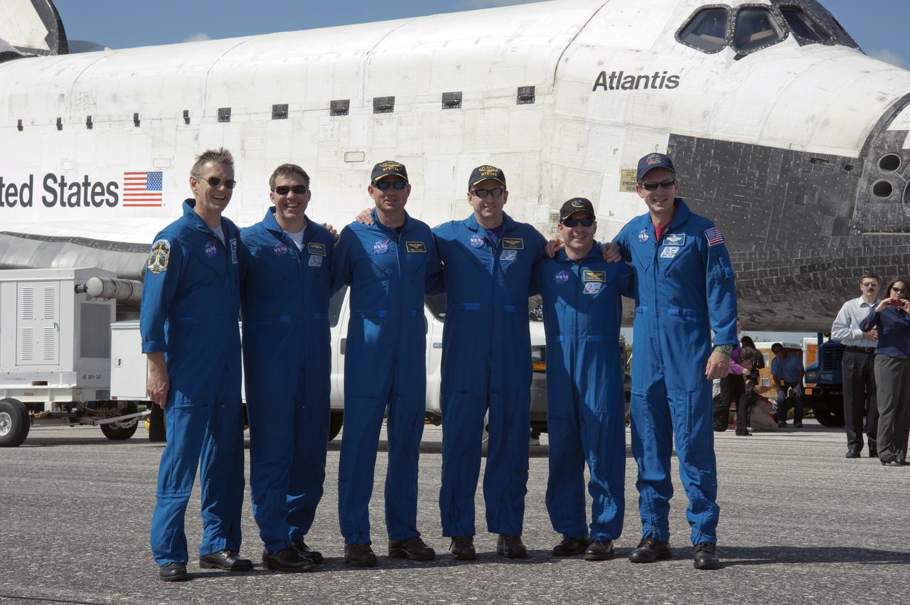 CAPE CANAVERAL, Fla. - At the Shuttle Landing Facility at NASA's Kennedy Space Center in Florida, the STS-132 crew members of space shuttle Atlantis pause for a post-landing photo opportunity. From left are Mission Specialists Piers Sellers and Steve Bowen; Pilot Tony Antonelli; Commander Ken Ham; and Mission Specialists Garrett Reisman and Michael Good. The six-member STS-132 crew carried the Russian-built Mini Research Module-1 to the space station. STS-132 is the 34th shuttle mission to the station, the 132nd shuttle mission overall and the last planned flight for Atlantis. For information on the STS-132 mission and crew, visit www.nasa.gov_mission_pages_shuttle_shuttlemissions_sts132_index.html. Photo credit: NASA_Kim Shiflett