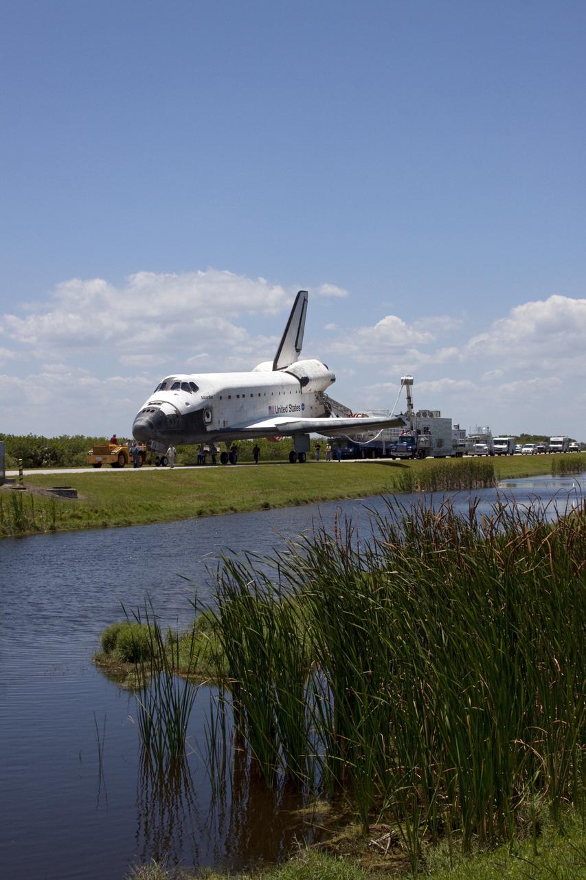 CAPE CANAVERAL, Fla. - At NASA's Kennedy Space Center in Florida, space shuttle Atlantis makes its slow trek from the Shuttle Landing Facility to Orbiter Processing Facility-1. Atlantis touched down on Runway 33 after 12 days in space, completing the 4.8-million mile STS-132 mission to the International Space Station. The six-member STS-132 crew carried the Russian-built Mini Research Module-1 to the space station. STS-132 is the 34th shuttle mission to the station, the 132nd shuttle mission overall and the last planned flight for Atlantis. For information on the STS-132 mission and crew, visit www.nasa.gov_mission_pages_shuttle_shuttlemissions_sts132_index.html. Photo credit: NASA_Jack Pfaller