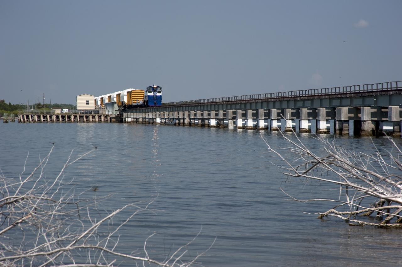 STS-335 LAUNCH ON NEED - LAST SRB SEGMENTS ARRIVAL - DRAW BRIDGE OVER BANANA RIVER