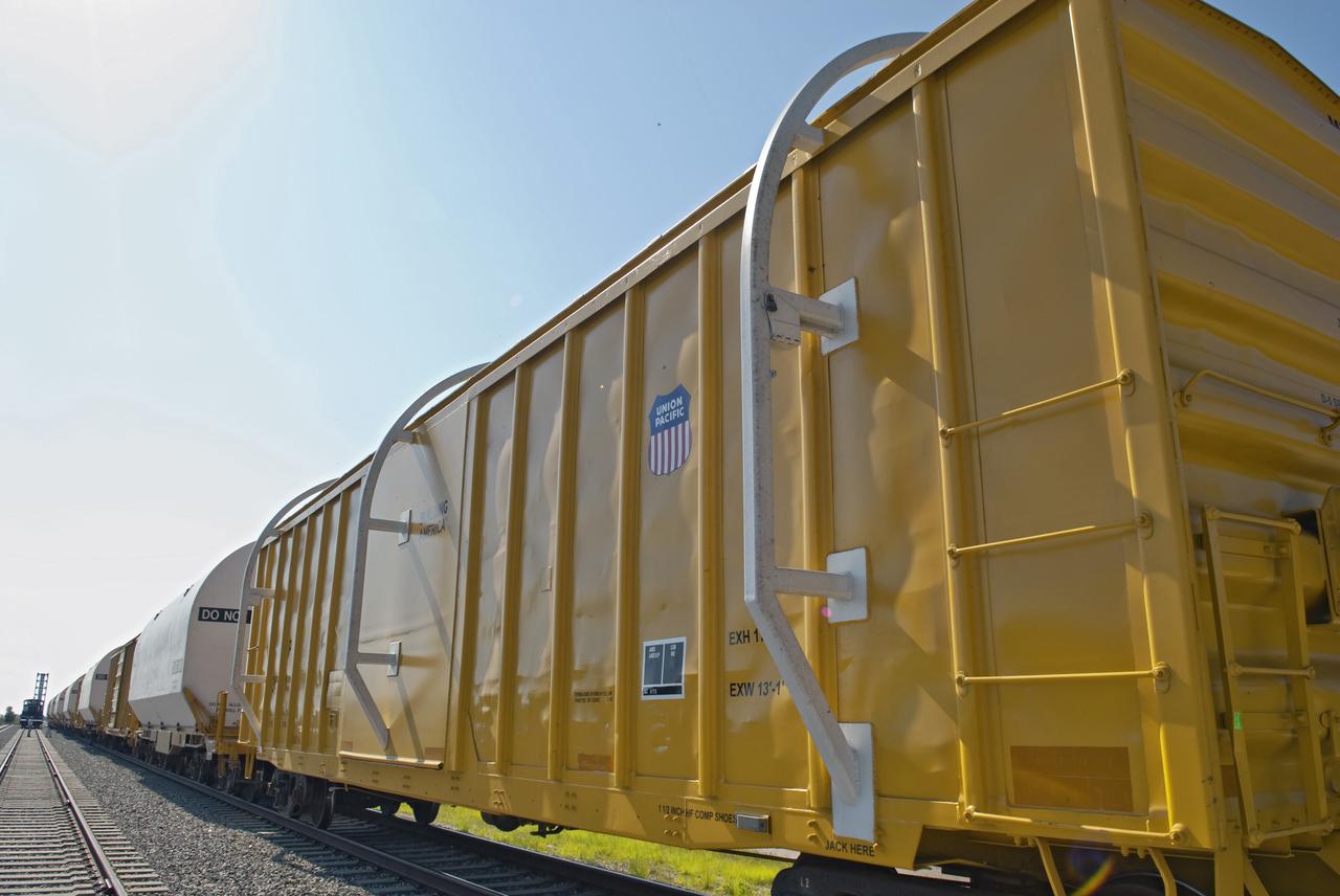 CAPE CANAVERAL, Fla. - At the Jay Jay Rail Yard in Titusville, Fla., the NASA Railroad train is ready to carry the last space shuttle solid rocket booster segments into NASA's Kennedy Space Center. The white railings on the orange spacer cars ensure clearance on their journey. Six cars transported the segments along the Florida East Coast Railway, which began at the ATK solid rocket booster plant in Promontory, Utah.  The booster segments will be used for shuttle Atlantis on what currently is planned as the 'launch on need,' or potential rescue mission for the final shuttle flight, Endeavour's STS-134 mission.  For information, visit www.nasa.gov_shuttle. Photo credit: NASA_Jim Grossmann