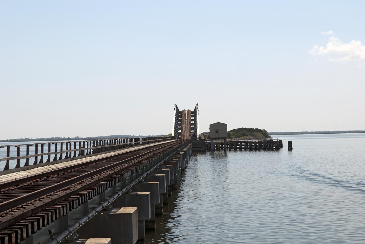 CAPE CANAVERAL, Fla. - The NASA Railroad draw bridge over the Indian River begins to close for the train carrying the last space shuttle solid rocket booster segments to NASA's Kennedy Space Center. Six cars transported the segments along the Florida East Coast Railway, which began at the ATK solid rocket booster plant in Promontory, Utah. The booster segments will be used for shuttle Atlantis on what currently is planned as the 'launch on need,' or potential rescue mission for the final shuttle flight, Endeavour's STS-134 mission.  For information, visit www.nasa.gov_shuttle. Photo credit: NASA_Jim Grossmann