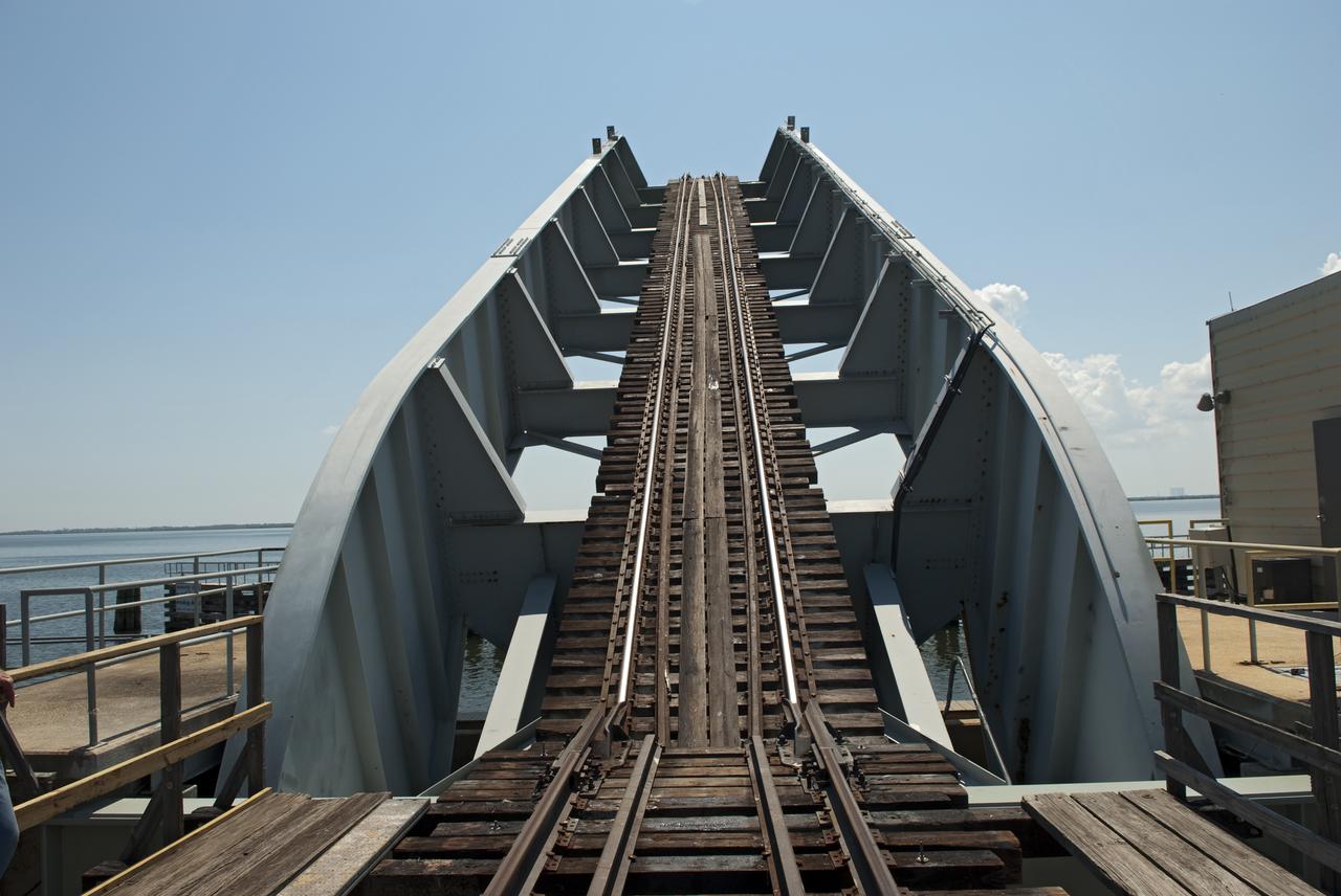 CAPE CANAVERAL, Fla. - The NASA Railroad draw bridge over the Indian River begins to close for the train carrying the last space shuttle solid rocket booster segments to NASA's Kennedy Space Center. Six cars transported the segments along the Florida East Coast Railway, which began at the ATK solid rocket booster plant in Promontory, Utah.  The booster segments will be used for shuttle Atlantis on what currently is planned as the 'launch on need,' or potential rescue mission for the final shuttle flight, Endeavour's STS-134 mission.  For information, visit www.nasa.gov_shuttle. Photo credit: NASA_Jim Grossmann