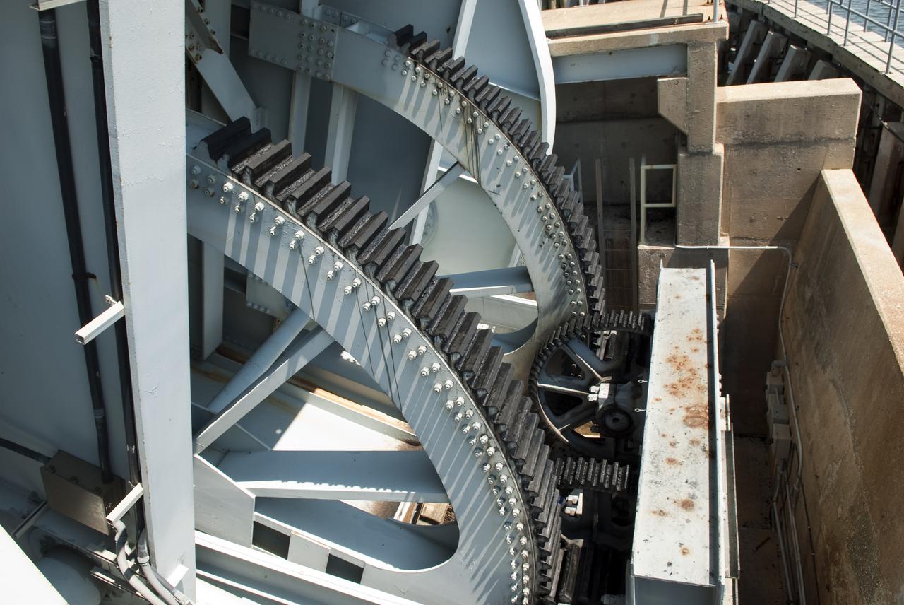 CAPE CANAVERAL, Fla. - Gears close the NASA Railroad draw bridge over the Indian River for the train carrying the last space shuttle solid rocket booster segments to NASA's Kennedy Space Center. Six cars transported the segments along the Florida East Coast Railway, which began at the ATK solid rocket booster plant in Promontory, Utah.  The booster segments will be used for shuttle Atlantis on what currently is planned as the 'launch on need,' or potential rescue mission for the final shuttle flight, Endeavour's STS-134 mission.  For information, visit www.nasa.gov_shuttle. Photo credit: NASA_Jim Grossmann