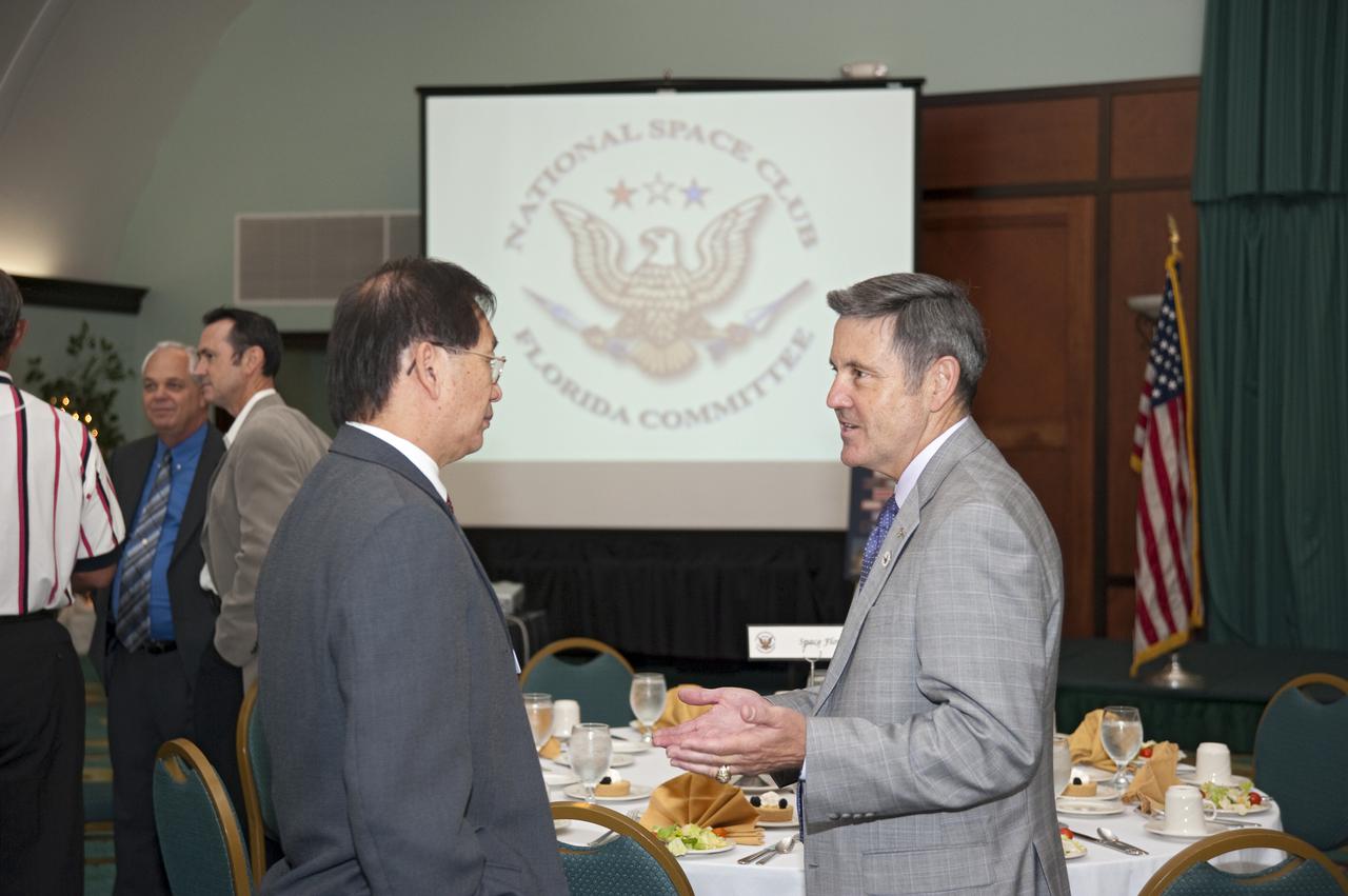 CAPE CANAVERAL, Fla. -- NASA Kennedy Space Center Director Bob Cabana talks with Tim Yang, the executive vice president of Yang Enterprises Inc., during the National Space Club Florida Committee's monthly meeting at the Radisson at the Port in Cape Canaveral, Fla. His speech, titled “KSC -- Today and Tomorrow,” addressed the future of NASA and possible changes to the space shuttle launch schedule later this month.   The committee, headquartered on Florida's Space Coast, is a non-profit corporation composed of private individuals representing industry, government, regional educational institutions and the media. NASA_Kim Shiflett