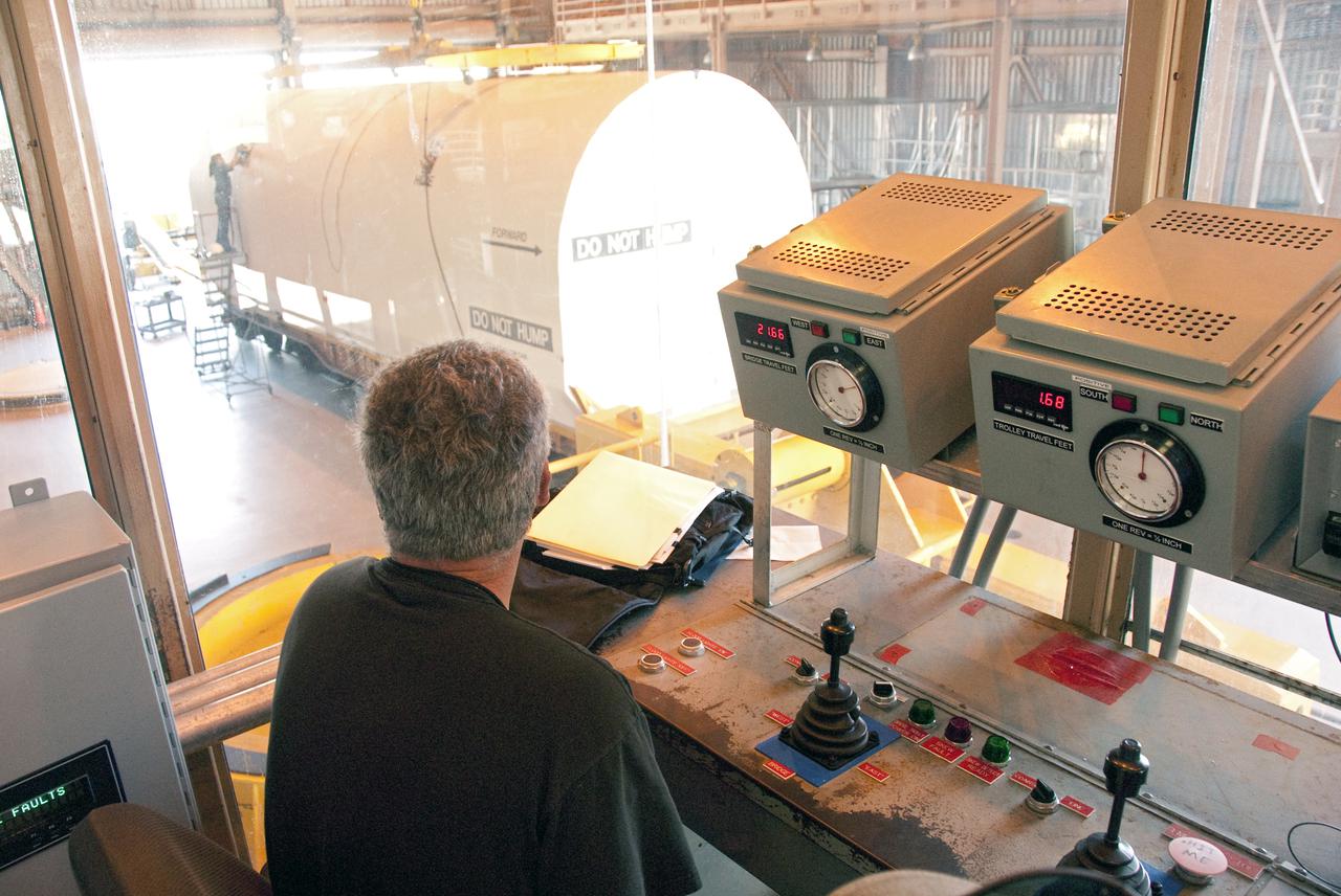CAPE CANAVERAL, Fla. -- In the Rotation, Processing and Surge Facility, or RSPF, at NASA's Kennedy Space Center in Florida, workers prepare for the propellant grain inspection and truing of the final solid rocket booster segments, which is a required safety analysis. The booster segments were manufactured at the ATK solid rocket booster plant in Promontory, Utah, and traveled to Kennedy along the Florida East Coast Railway.  The booster segments will be stacked and then mated to space shuttle Atlantis and its external fuel tank in the Vehicle Assembly Building. The segments will be used for what currently is planned as the 'launch on need,' or potential rescue mission for the final shuttle flight, Endeavour's STS-134 mission. For information, visit www.nasa.gov_shuttle. Photo credit: NASA_Cory Huston