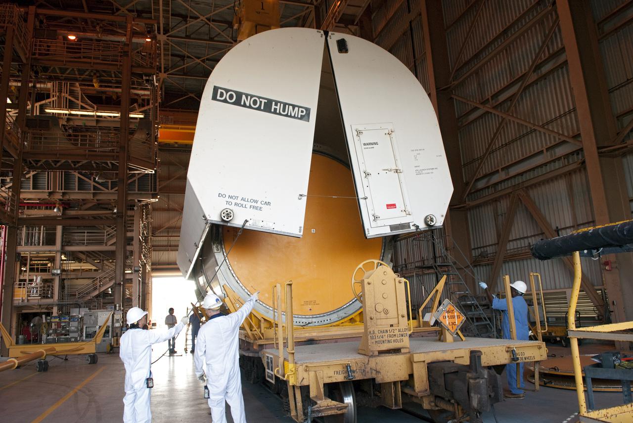 CAPE CANAVERAL, Fla. -- In the Rotation, Processing and Surge Facility, or RSPF, at NASA's Kennedy Space Center in Florida, workers prepare for the propellant grain inspection and truing of the final solid rocket booster segments, which is a required safety analysis. The booster segments were manufactured at the ATK solid rocket booster plant in Promontory, Utah, and traveled to Kennedy along the Florida East Coast Railway.  The booster segments will be stacked and then mated to space shuttle Atlantis and its external fuel tank in the Vehicle Assembly Building. The segments will be used for what currently is planned as the 'launch on need,' or potential rescue mission for the final shuttle flight, Endeavour's STS-134 mission. For information, visit www.nasa.gov_shuttle. Photo credit: NASA_Cory Huston
