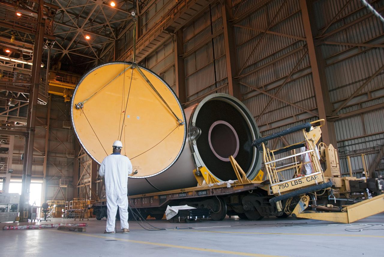 CAPE CANAVERAL, Fla. -- In the Rotation, Processing and Surge Facility, or RSPF, at NASA's Kennedy Space Center in Florida, workers make sure the final solid rocket booster segments are level, balanced and concentric, which is a required safety analysis. Workers also will perform a propellant grain inspection. The booster segments were manufactured at the ATK solid rocket booster plant in Promontory, Utah, and traveled to Kennedy along the Florida East Coast Railway.  The booster segments will be stacked and then mated to space shuttle Atlantis and its external fuel tank in the Vehicle Assembly Building. The segments will be used for what currently is planned as the 'launch on need,' or potential rescue mission for the final shuttle flight, Endeavour's STS-134 mission. For information, visit www.nasa.gov_shuttle. Photo credit: NASA_Cory Huston