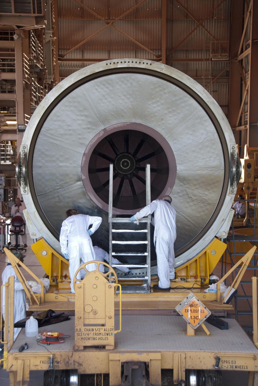 CAPE CANAVERAL, Fla. -- In the Rotation, Processing and Surge Facility, or RSPF, at NASA's Kennedy Space Center in Florida, workers prepare for the propellant grain inspection of the final solid rocket booster segments, which is a required safety analysis. The booster segments were manufactured at the ATK solid rocket booster plant in Promontory, Utah, and traveled to Kennedy along the Florida East Coast Railway.  The booster segments will be stacked and then mated to space shuttle Atlantis and its external fuel tank in the Vehicle Assembly Building. The segments will be used for what currently is planned as the 'launch on need,' or potential rescue mission for the final shuttle flight, Endeavour's STS-134 mission. For information, visit www.nasa.gov_shuttle. Photo credit: NASA_Cory Huston