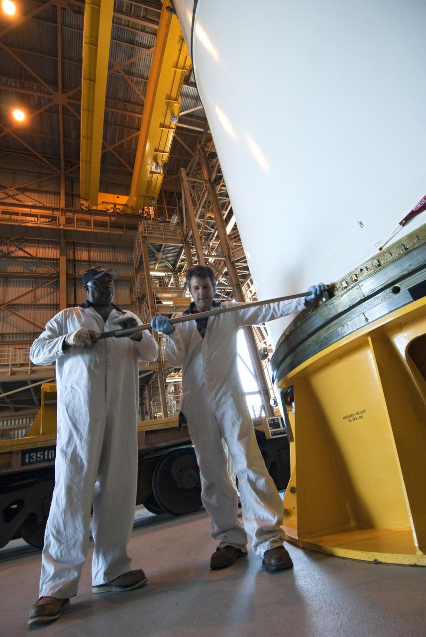 STS-335 LAUNCH ON NEED - SEGMENT LIFT TO VERTICAL AND MOVE TO WORKSTAND