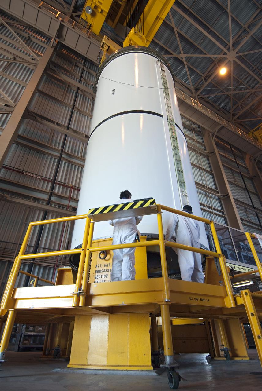 STS-335 LAUNCH ON NEED - SEGMENT LIFT TO VERTICAL AND MOVE TO WORKSTAND
