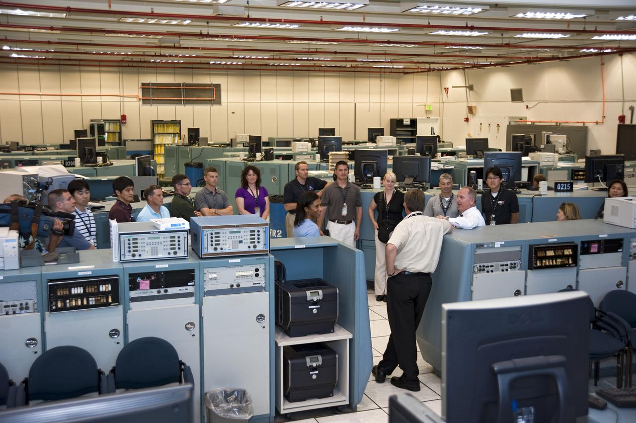 CAPE CANAVERAL, Fla. --- At NASA's Kennedy Space Center in Florida, the Class of 2009 Astronaut Candidates, also called ASCANs, tour Firing Room 2 of the Launch Control Center. It takes about 200 launch team members monitoring critical operations and components to launch a space shuttle. The new astronaut candidates for NASA are Serena M. Aunon, Jeanette J. Epps, Air Force Maj. Jack D. Fischer, Air Force Lt. Col. Michael S. Hopkins, Kjell N. Lindgren, Kathleen 'Kate' Rubins, Navy Cmdr. Scott D. Tingle, Army Lt. Col. Mark T. Vande, and Navy Lt. Cmdr. Gregory R. 'Reid' Wiseman. The new astronaut candidates for the Japan Aerospace Exploration Agency, or JAXA, are Norishige Kanai, Takuya Onishi and Kimiya Yui. The new astronaut candidates for the Canadian Space Agency, or CSA, are Jeremy Hansen and David Saint-Jacques. Photo Credit: NASA_Kim Shiflett